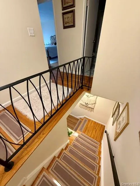 Lovely hardwood staircase with carpeted treads Lovely hardwood staircase with carpeted treads