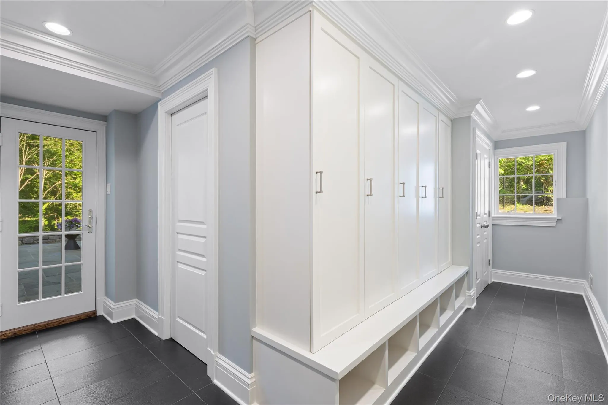 Mudroom, built-ins, laundry room, access to bluestone patio and garage Mudroom, built-ins, laundry room, access to bluestone patio and garage