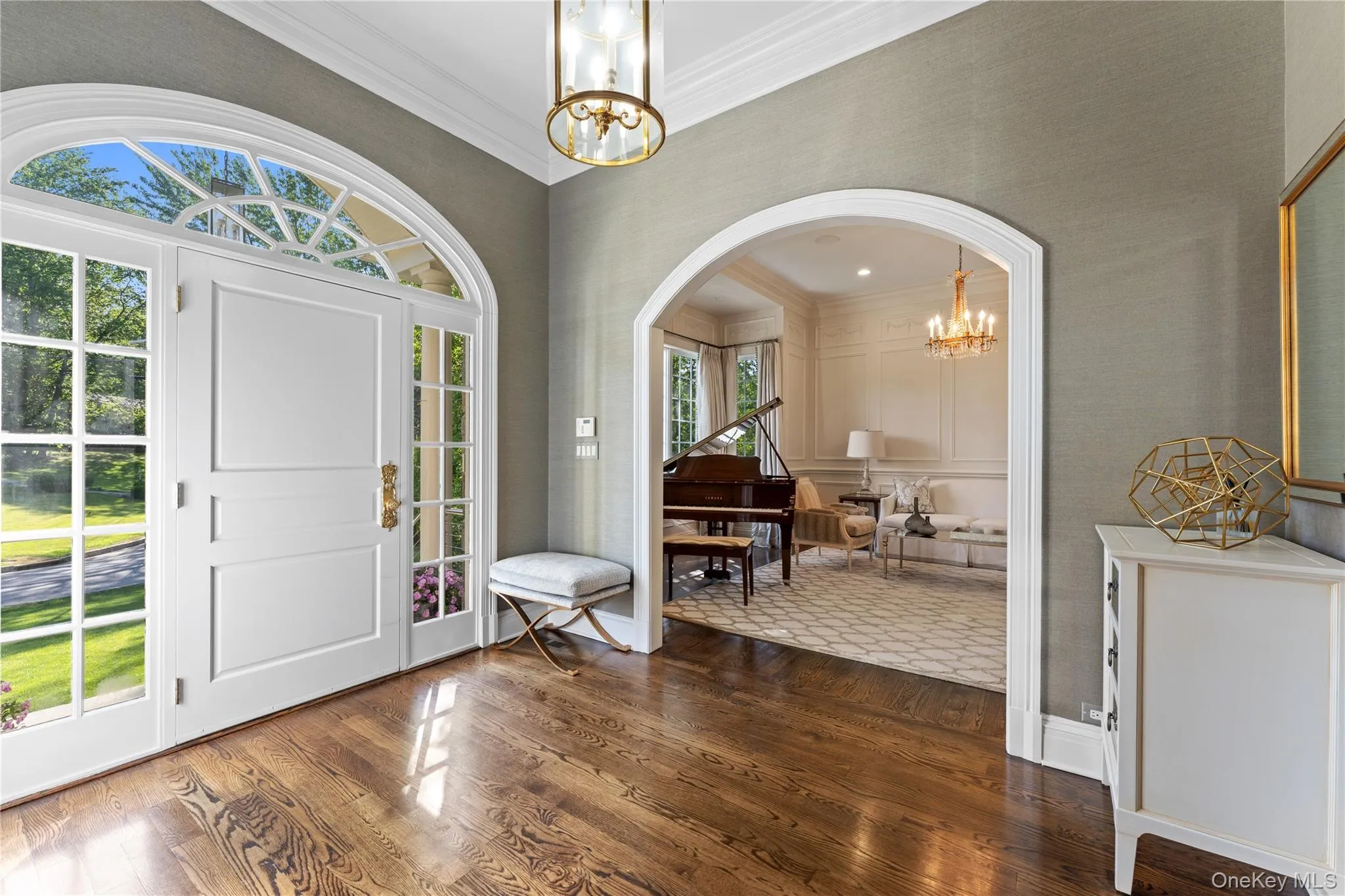 Bright entryway with 11’ ceilings, crown moldings, glass paneled front door Bright entryway with 11’ ceilings, crown moldings, glass paneled front door