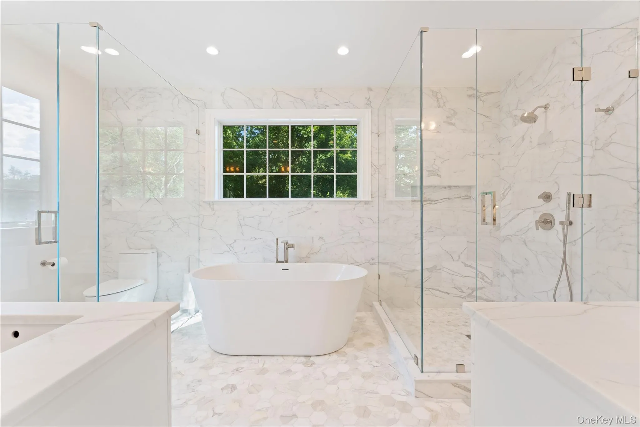NEW marble primary bathroom with soaking tub, water closet, double vanity, custom cabinetry, oversized shower NEW marble primary bathroom with soaking tub, water closet, double vanity, custom cabinetry, oversized shower