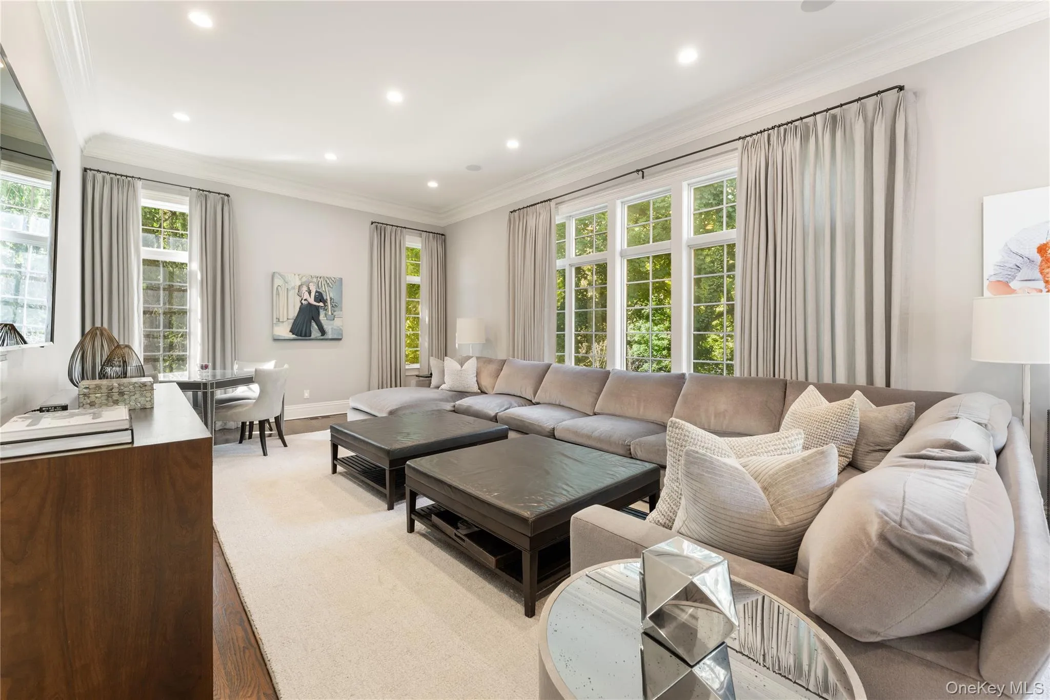 Fabulous family room with floor to ceiling windows, French sliding doors to deck and flows into the chef’s kitchen Fabulous family room with floor to ceiling windows, French sliding doors to deck and flows into the chef’s kitchen