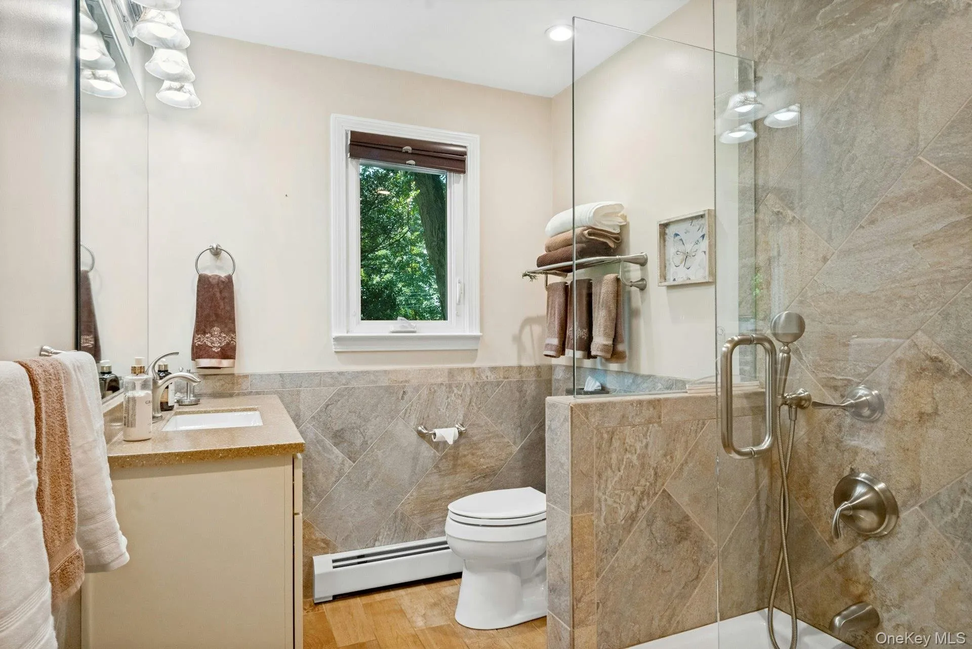 beautifully updated Hall bath with Kohler fixtures, stone tiled shower. beautifully updated Hall bath with Kohler fixtures, stone tiled shower.