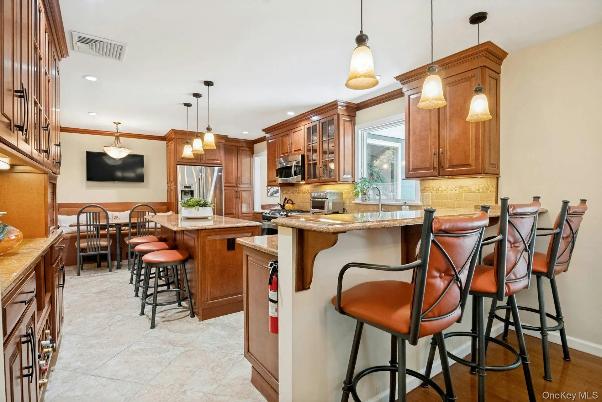 Expansive eat-in Kitchen with bar stool seating, high top seating and dining nook. Expansive eat-in Kitchen with bar stool seating, high top seating and dining nook.