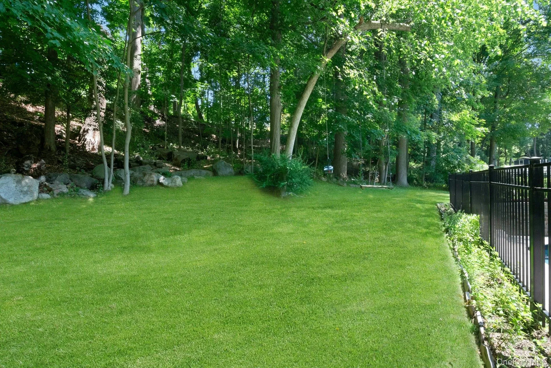 Nice flat usable yard behind and above the pool. Nice flat usable yard behind and above the pool.