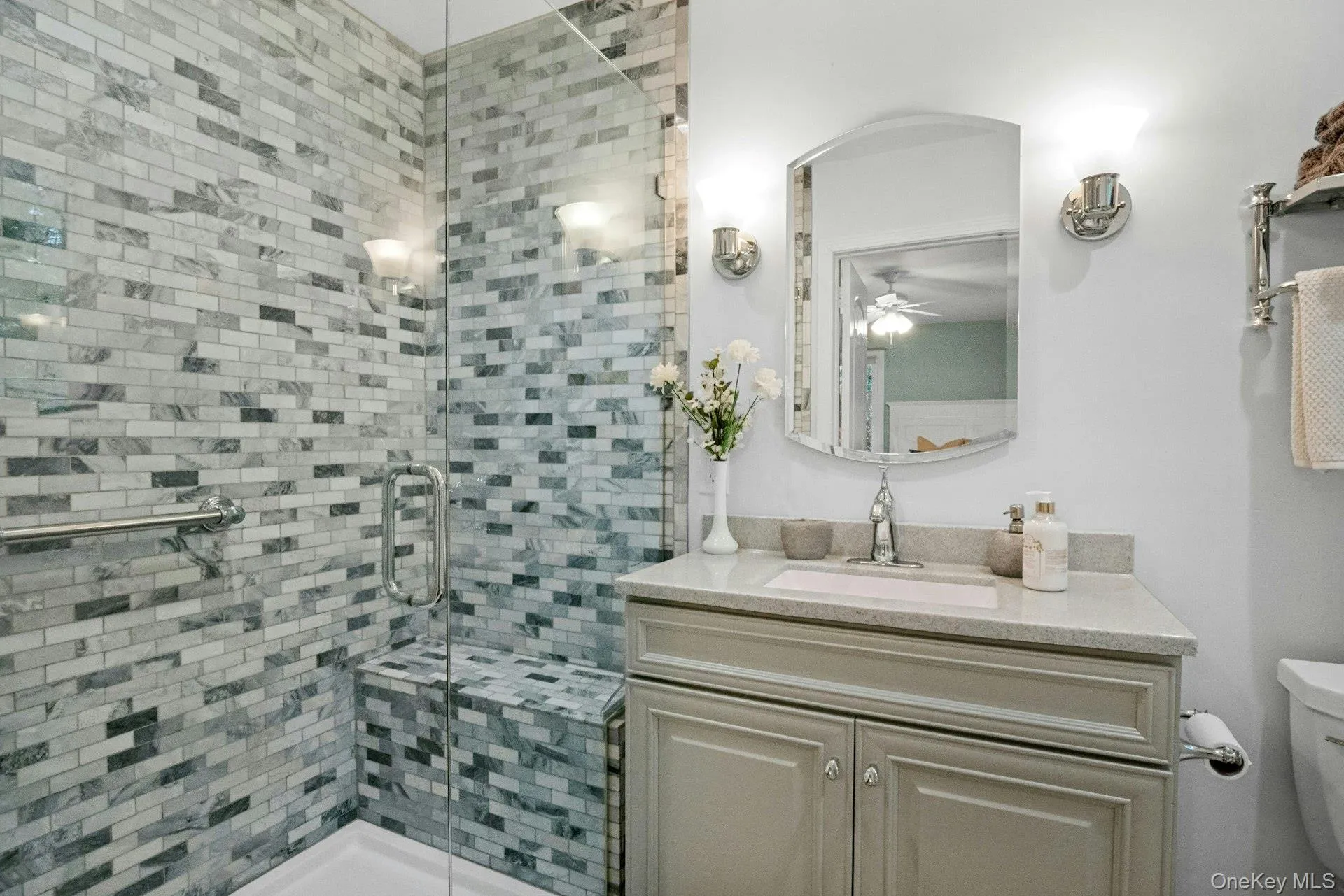 full bath with convenient shower seating built in; adjoining bedroom 3. full bath with convenient shower seating built in; adjoining bedroom 3.