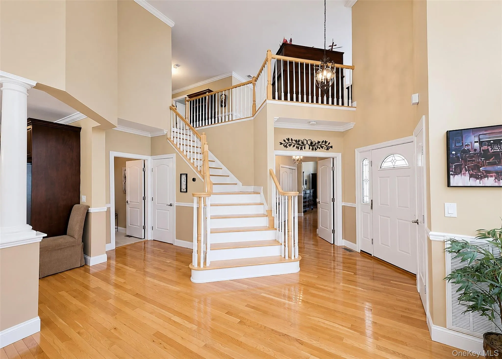 Grand 2-Story Entrance Hall With Oak Banister Leads Up To The Private Loft Overlooking The Main Living Area. Grand 2-Story Entrance Hall With Oak Banister Leads Up To The Private Loft Overlooking The Main Living Area.