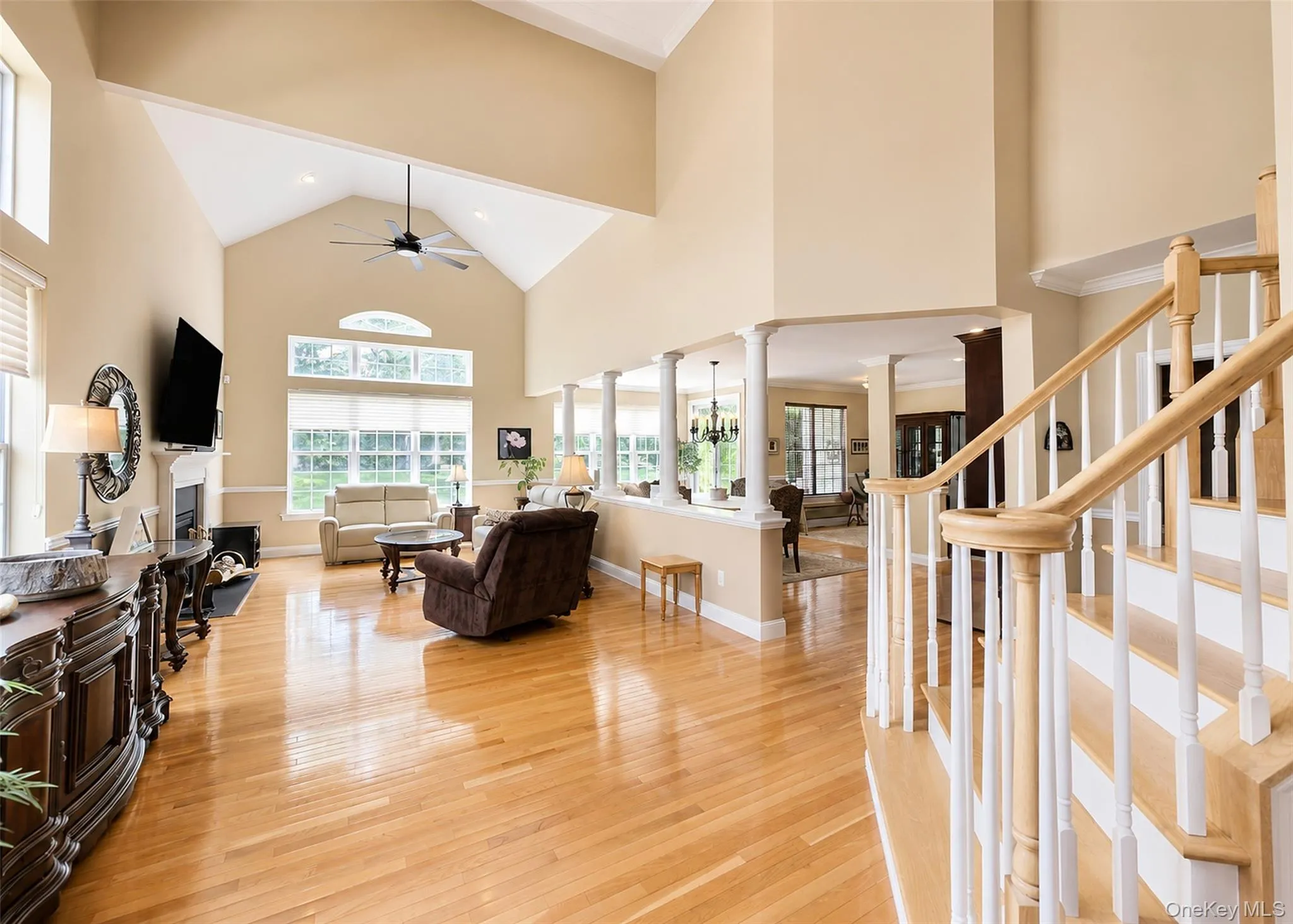 Spacious Sunlit Living Rm W/Floor To Ceiling Windows, Cathedral Ceiling, & Pillar Columns. Spacious Sunlit Living Rm W/Floor To Ceiling Windows, Cathedral Ceiling, & Pillar Columns.