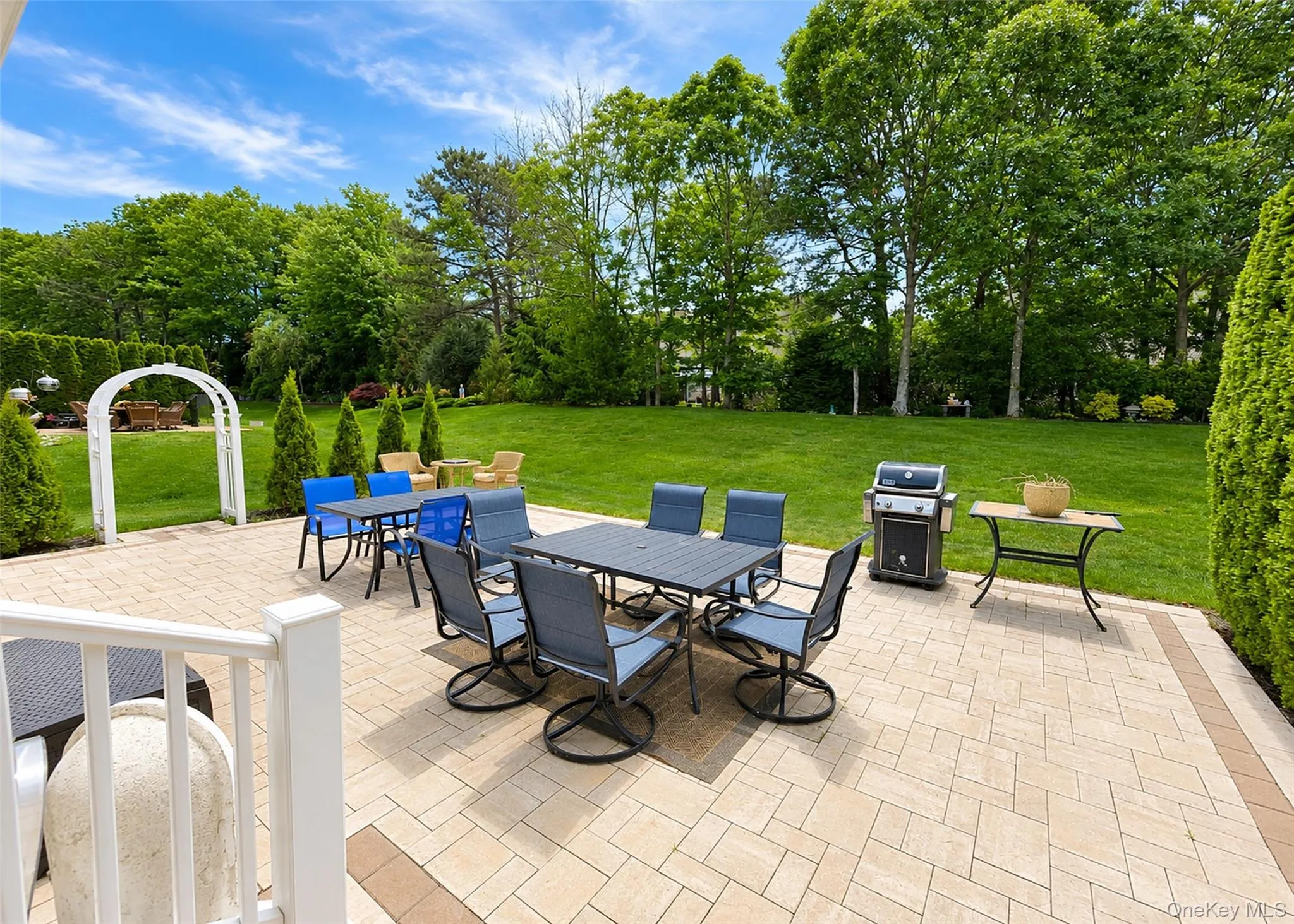 Serene Backyard With Large Paver Patio. Serene Backyard With Large Paver Patio.