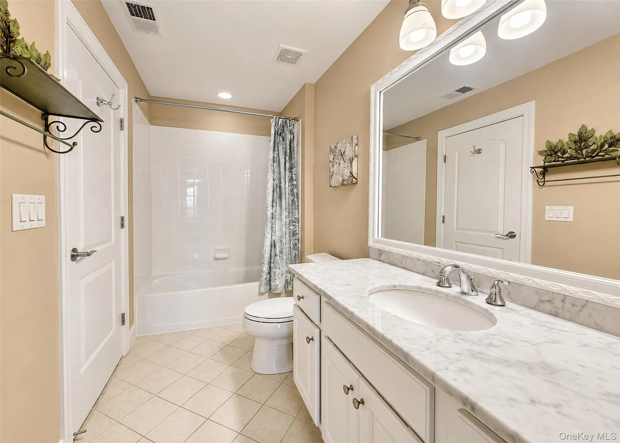 Custom, Updated Ensuite Full Bath W/Carrera Marble Vanity, Fiberglass Surround Bath/Shower Combo, Kohler Fixtures, Hi-Hats, & Tile Flooring. Custom, Updated Ensuite Full Bath W/Carrera Marble Vanity, Fiberglass Surround Bath/Shower Combo, Kohler Fixtures, Hi-Hats, & Tile Flooring.