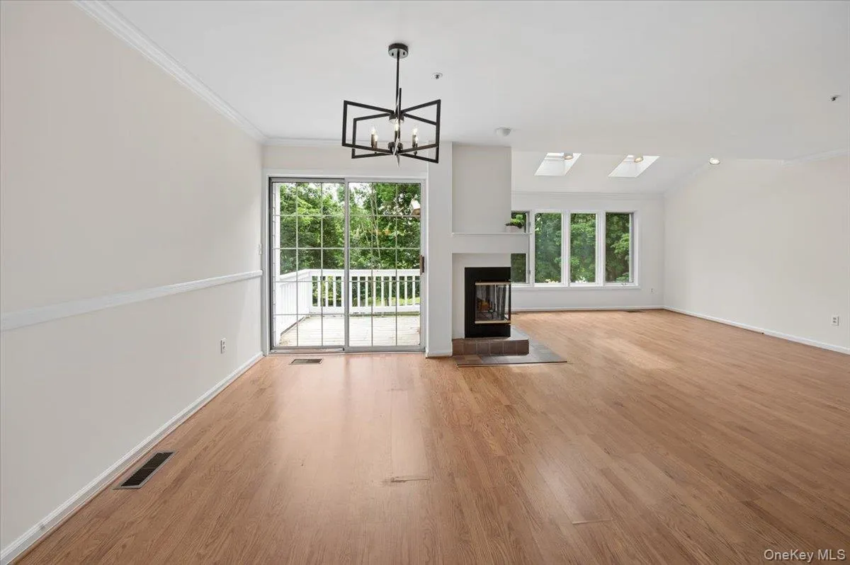 Open concept Dr, LR with wood Burning FPL and access to Balcony Open concept Dr, LR with wood Burning FPL and access to Balcony