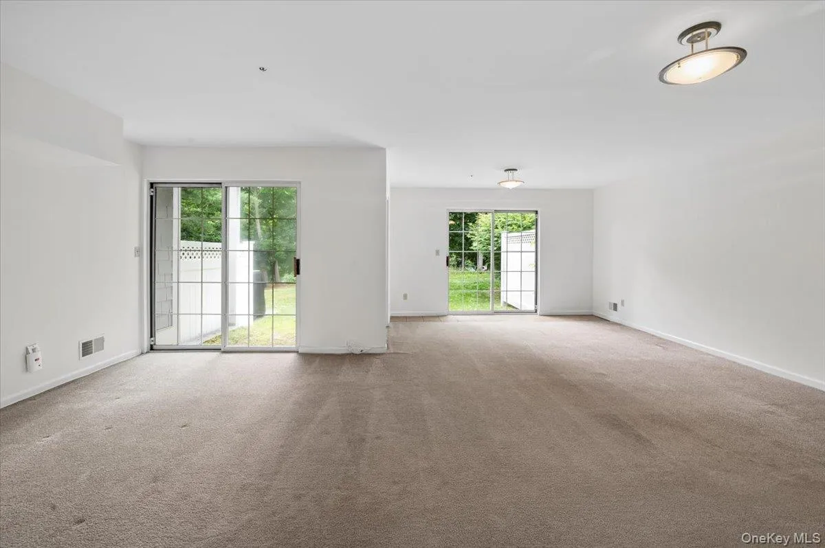 Lower Level family room with 2 slider doors to yard area Lower Level family room with 2 slider doors to yard area