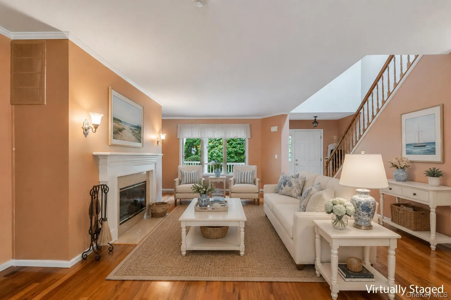 Living room has beautiful polished hardwood floors and crown molding throughout window treatment stay Living room has beautiful polished hardwood floors and crown molding throughout window treatment stay