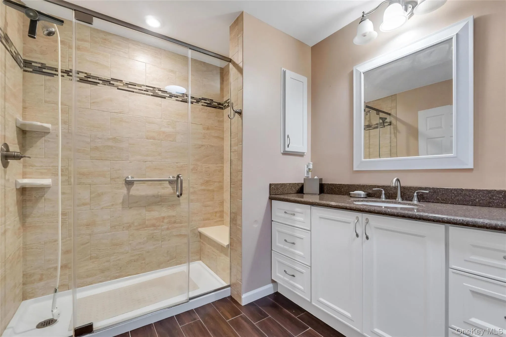 Master bedroom bathroom, tiled shower area w bench seat , and floors. Granite countertop. Master bedroom bathroom, tiled shower area w bench seat , and floors. Granite countertop.