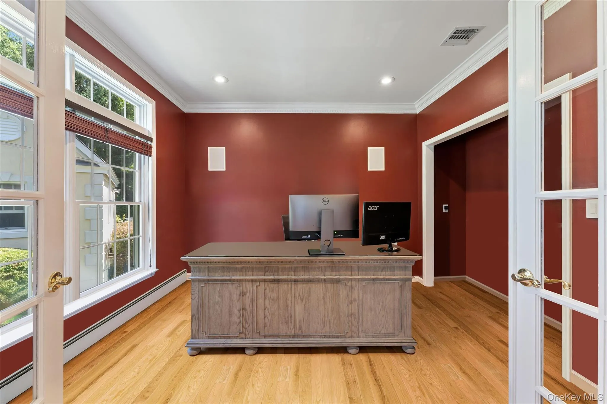 Office area with crown molding, light wood-style floors, a baseboard heating unit, and recessed lighting Office area with crown molding, light wood-style floors, a baseboard heating unit, and recessed lighting