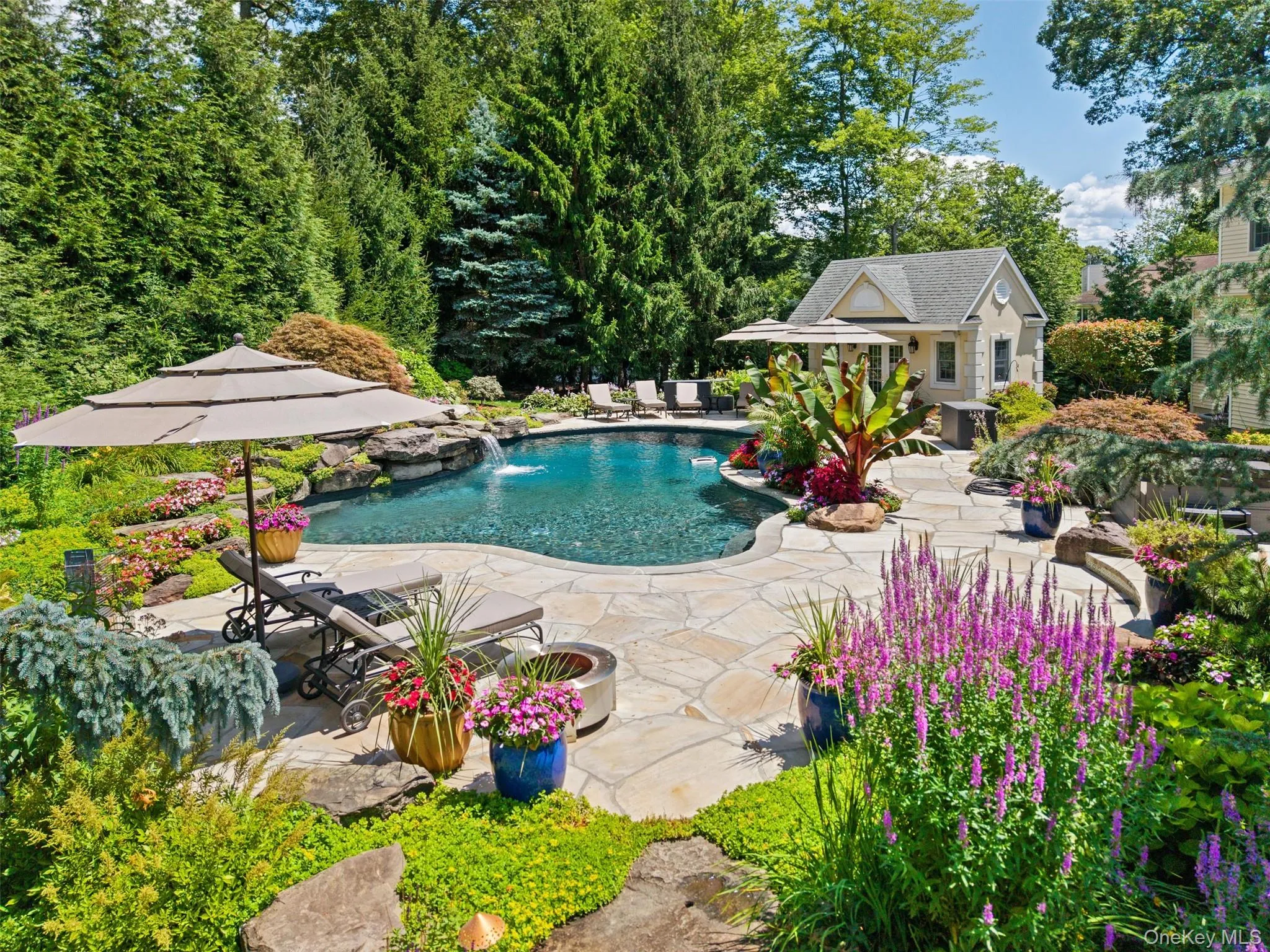 Gunite swimming pool featuring a patio, pool house, spa, outdoor kitchen & custom pizza oven Gunite swimming pool featuring a patio, pool house, spa, outdoor kitchen & custom pizza oven