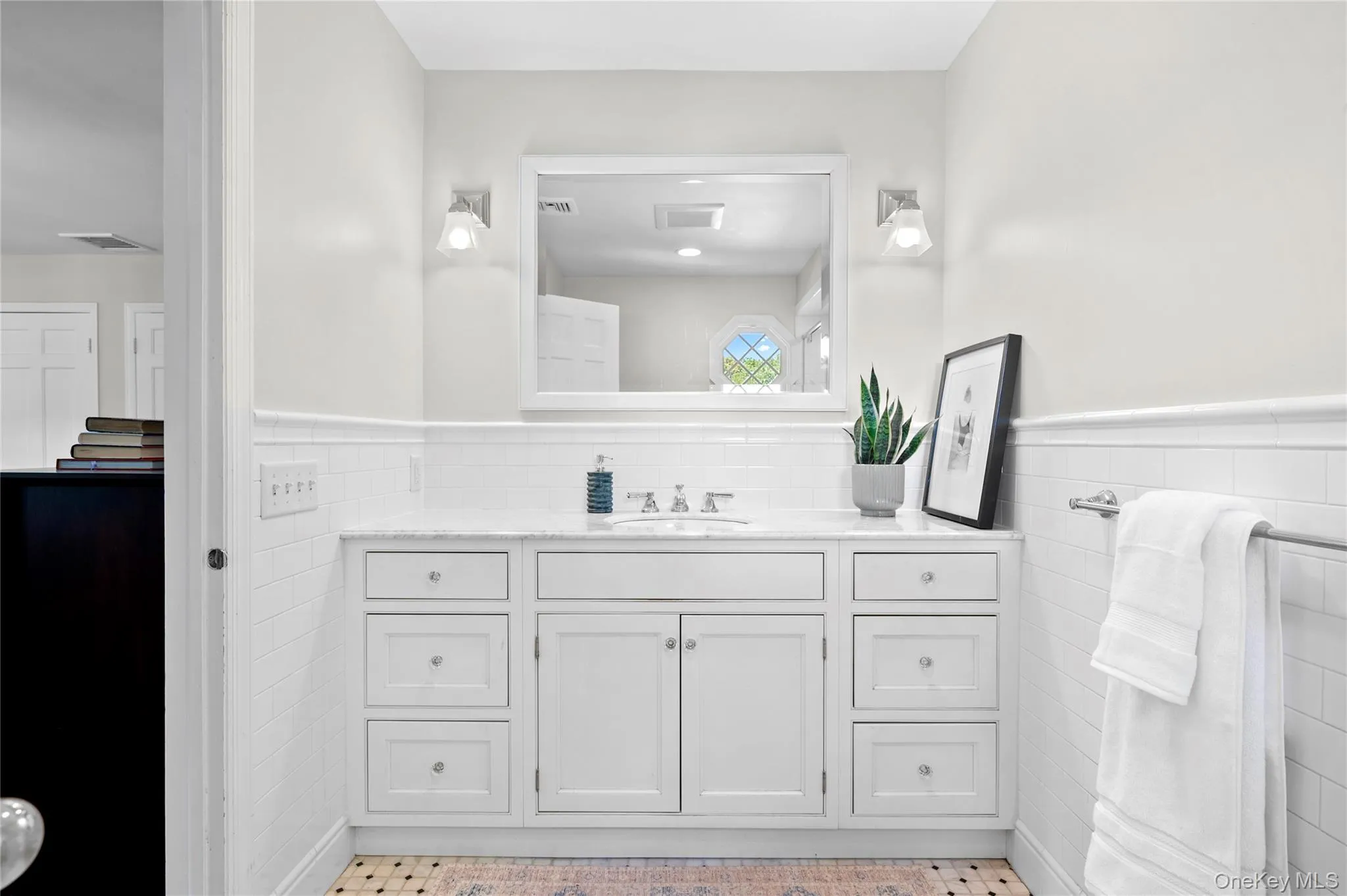 Beautifully designed ensuite bathroom with an elegant vanity Beautifully designed ensuite bathroom with an elegant vanity
