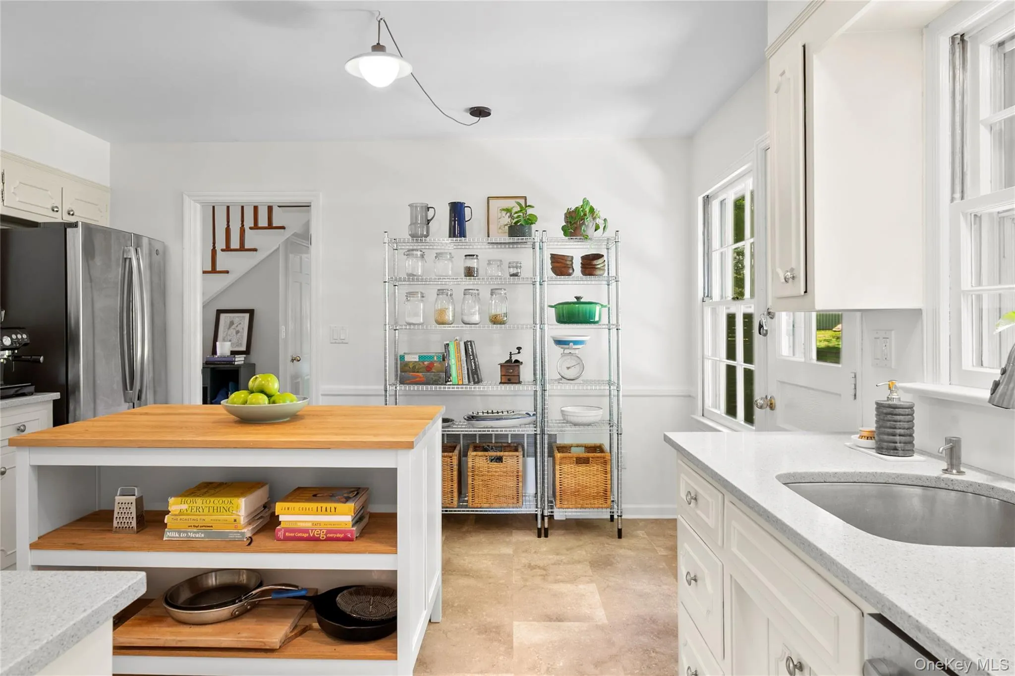Centrally located kitchen with direct access to the main-floor hallway, providing a practical and efficient layout Centrally located kitchen with direct access to the main-floor hallway, providing a practical and efficient layout