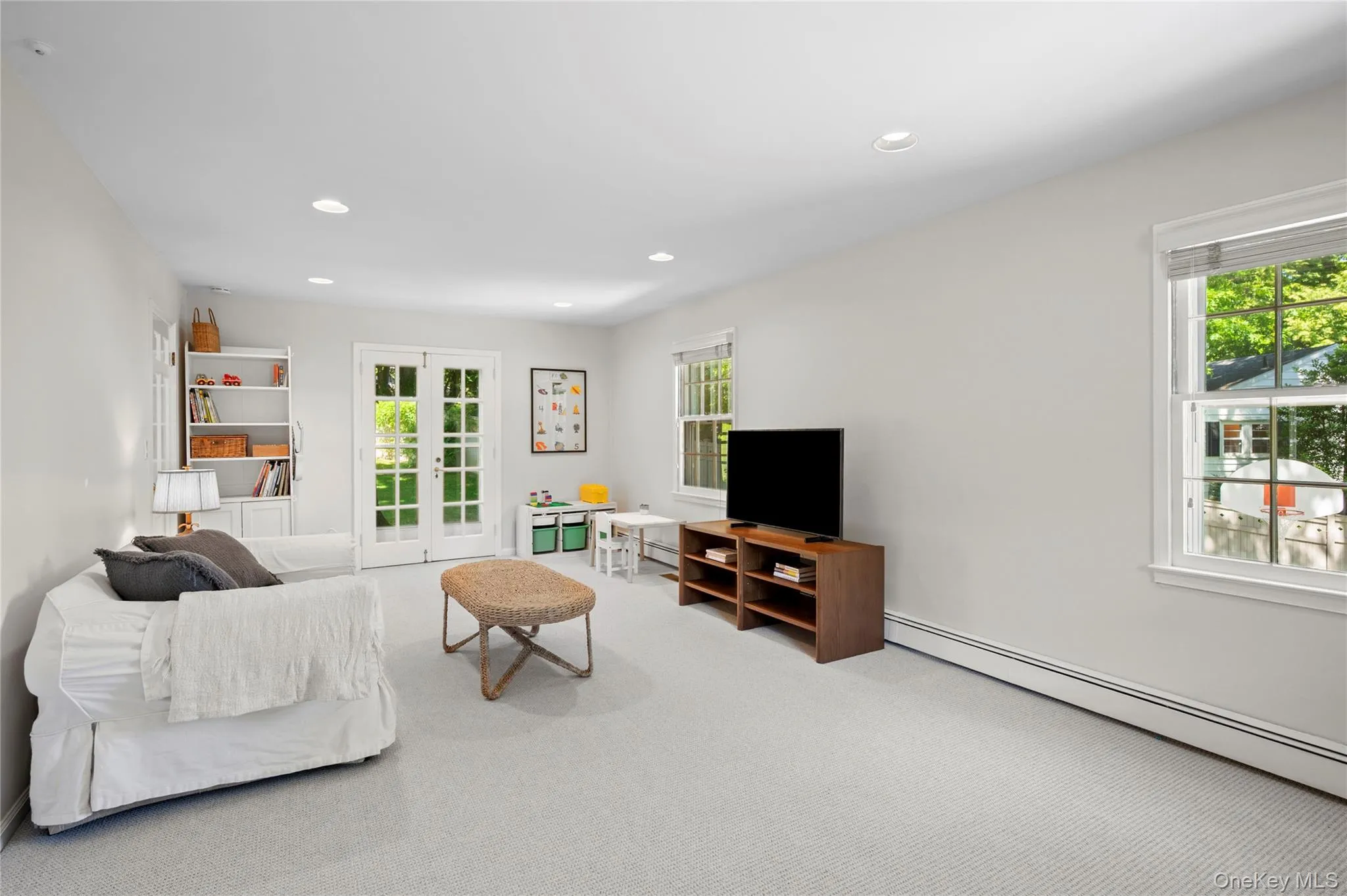 Versatile family room suitable for use as a TV room, playroom, or office space. Versatile family room suitable for use as a TV room, playroom, or office space.