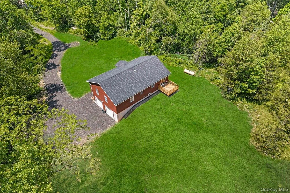 Rear and side view of the property. (Yard photos are enhanced to show the potential after seeding). Rear and side view of the property. (Yard photos are enhanced to show the potential after seeding).