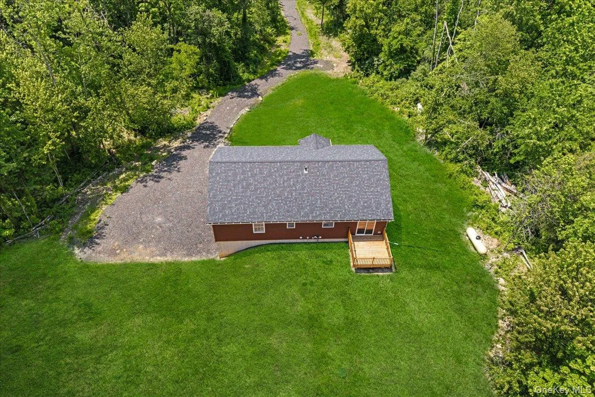 Rear view of the property. (Yard photos are enhanced to show the potential after seeding). Rear view of the property. (Yard photos are enhanced to show the potential after seeding).