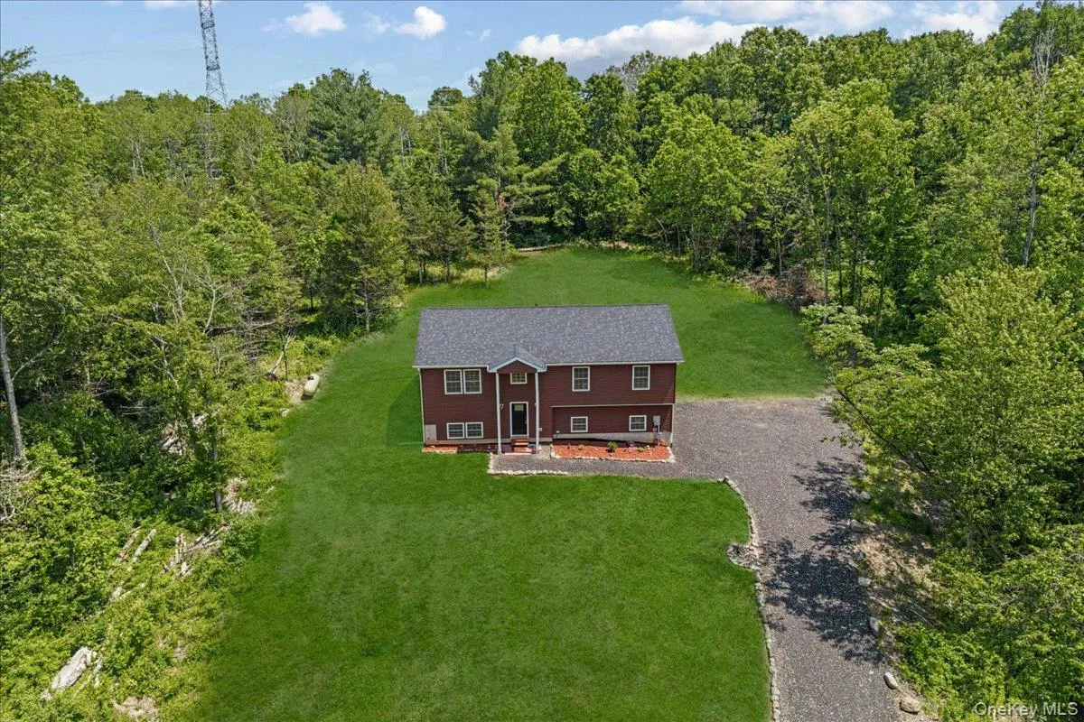 Aerial view looking from the front of home. (Yard photos are enhanced to show the potential after seeding). Aerial view looking from the front of home. (Yard photos are enhanced to show the potential after seeding).