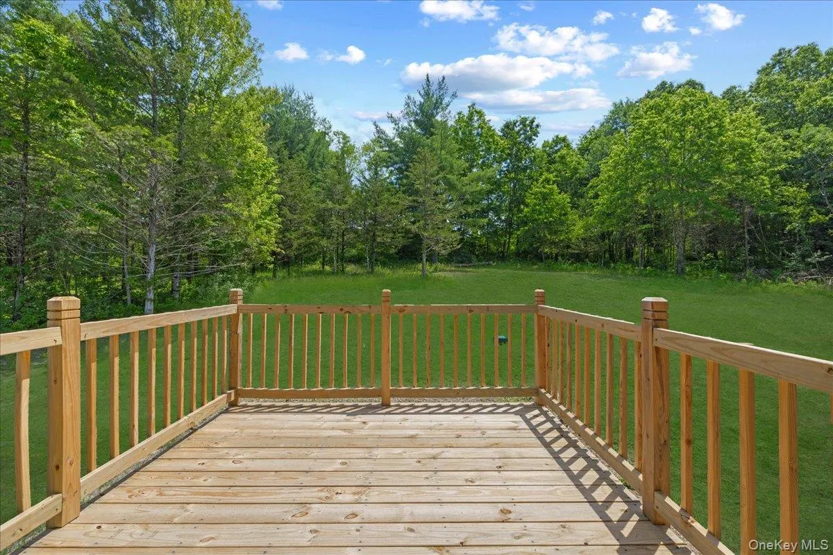 Rear deck looking towards the yard. (Yard photos are enhanced to show the potential after seeding). Rear deck looking towards the yard. (Yard photos are enhanced to show the potential after seeding).