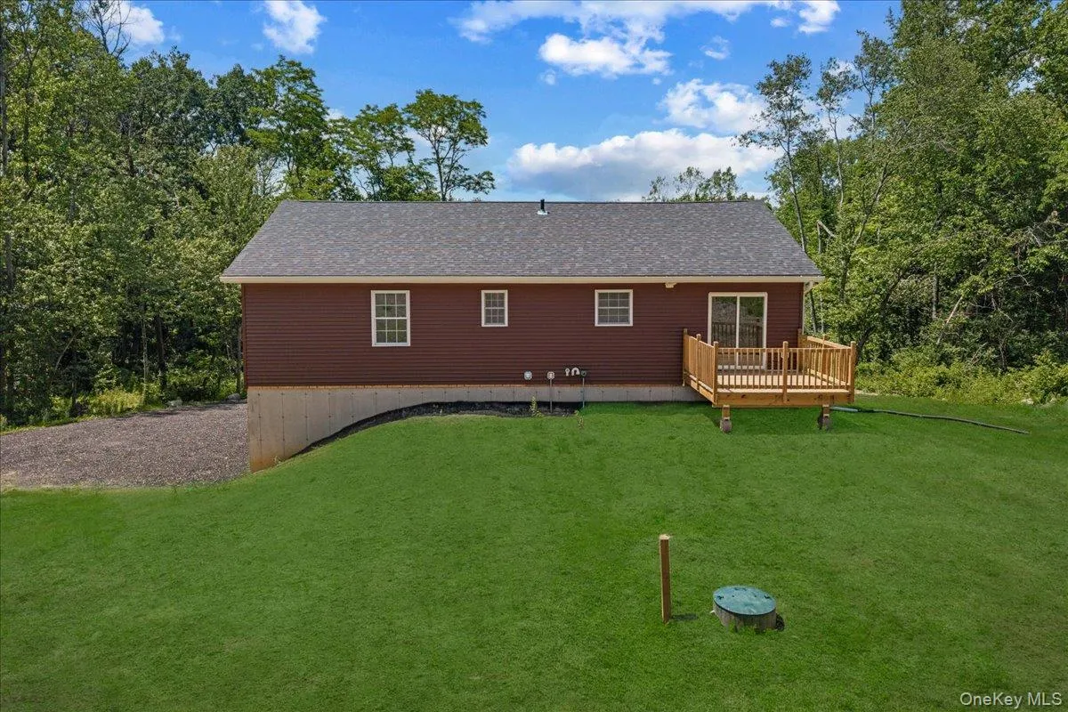 Yard and deck. (Yard photos are enhanced to show the potential after seeding). Yard and deck. (Yard photos are enhanced to show the potential after seeding).