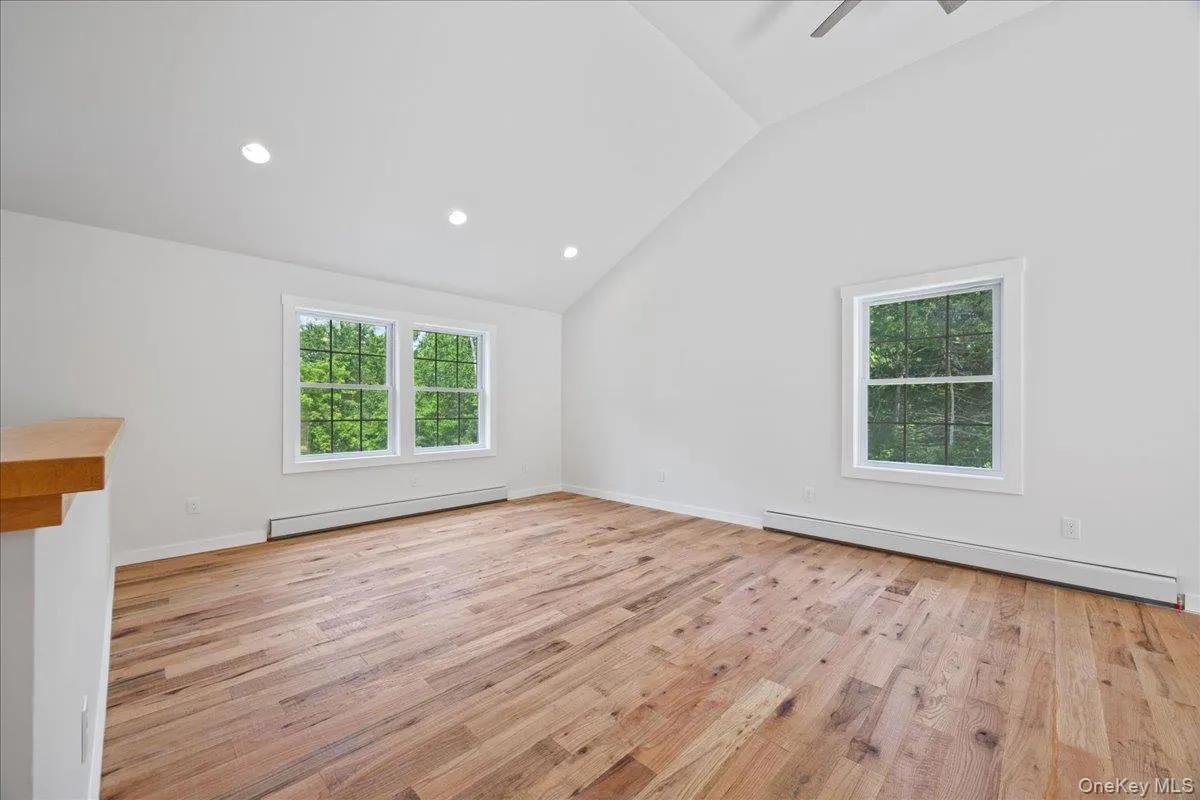 Vaulted ceilings and gleaming hardwood floors. Vaulted ceilings and gleaming hardwood floors.