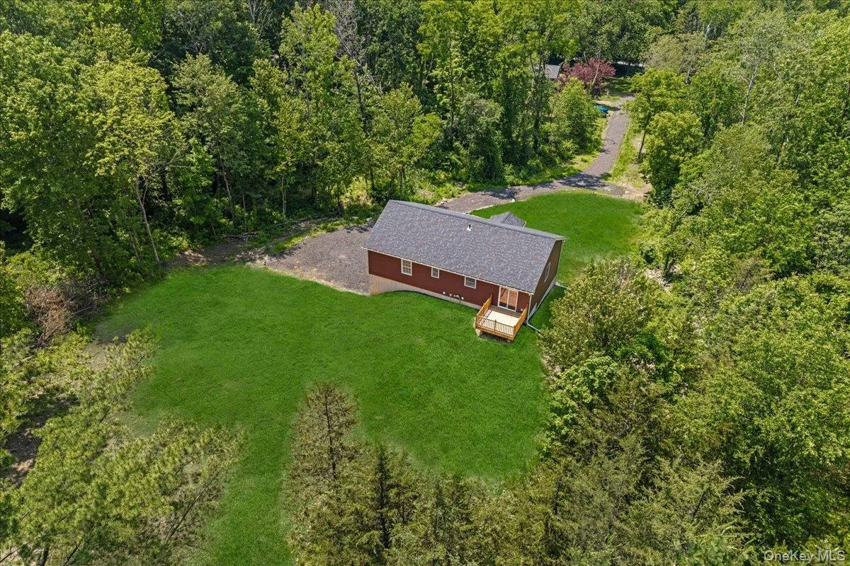 Rear view of the property. (Yard photos are enhanced to show the potential after seeding). Rear view of the property. (Yard photos are enhanced to show the potential after seeding).
