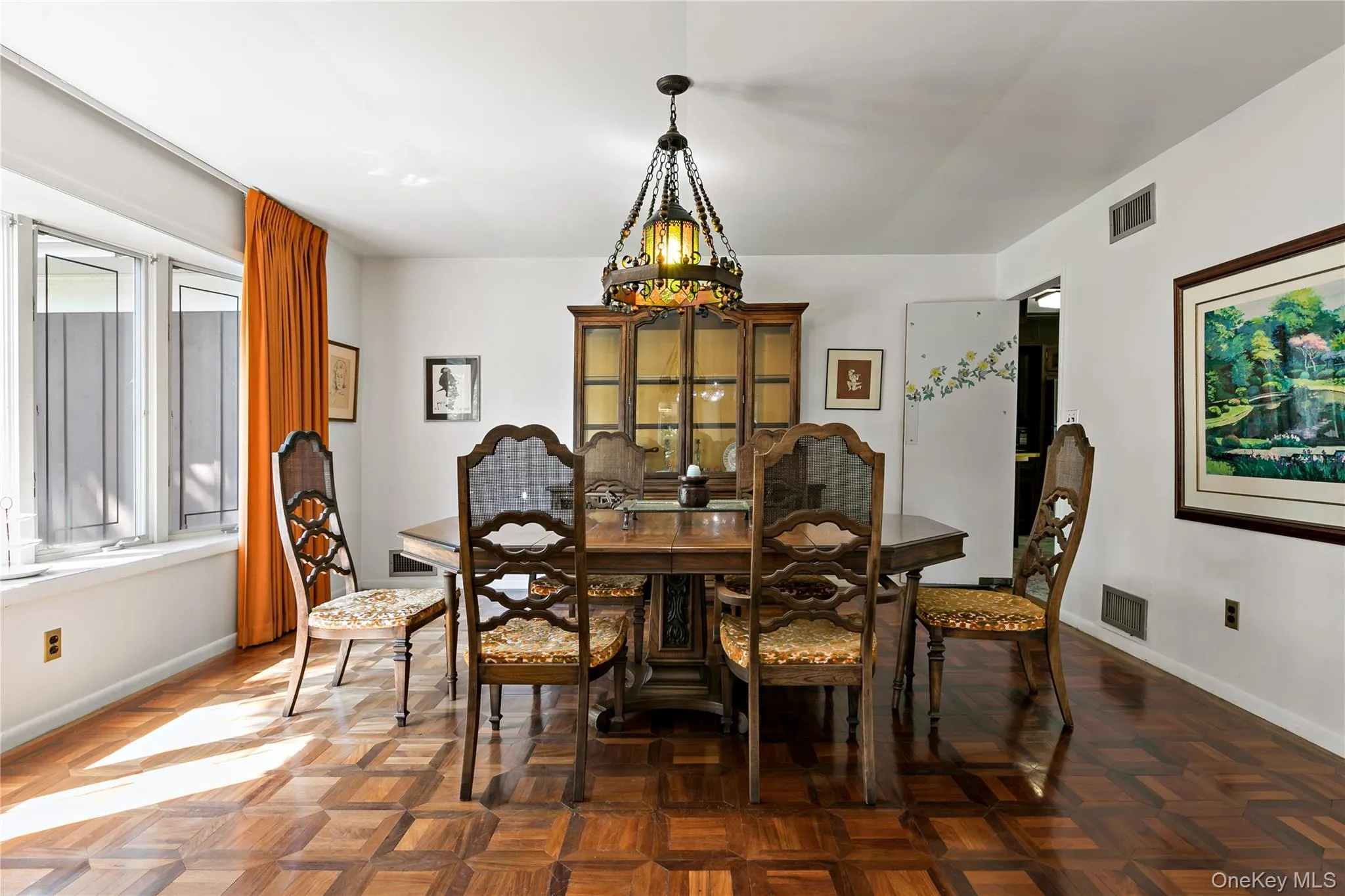 Expansive dining room featuring beautiful hardwood floors and walls of windows Expansive dining room featuring beautiful hardwood floors and walls of windows