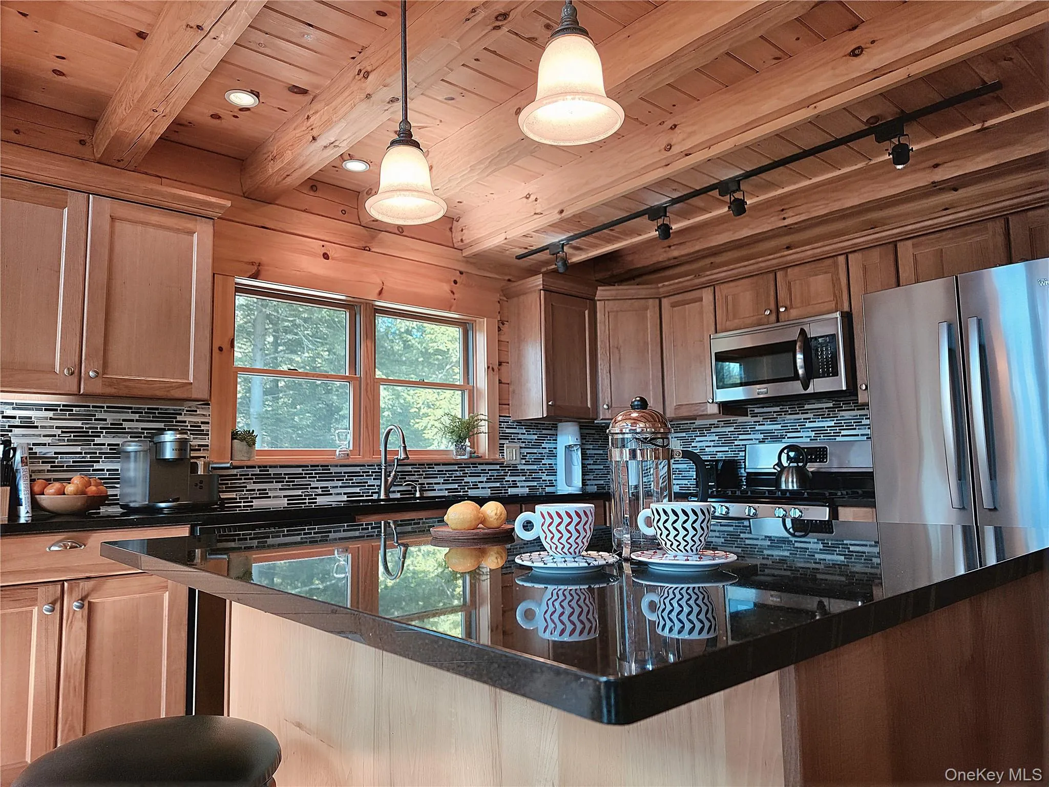 Spacious kitchen features granite counter tops, staginess steel appliances, dishwasher, kitchen island Spacious kitchen features granite counter tops, staginess steel appliances, dishwasher, kitchen island