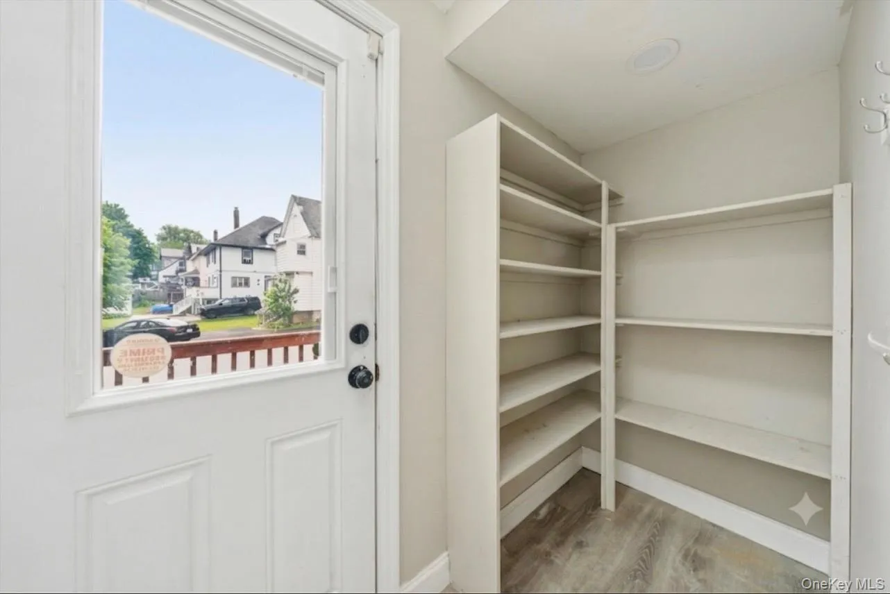 Back entry with shelving. Back entry with shelving.