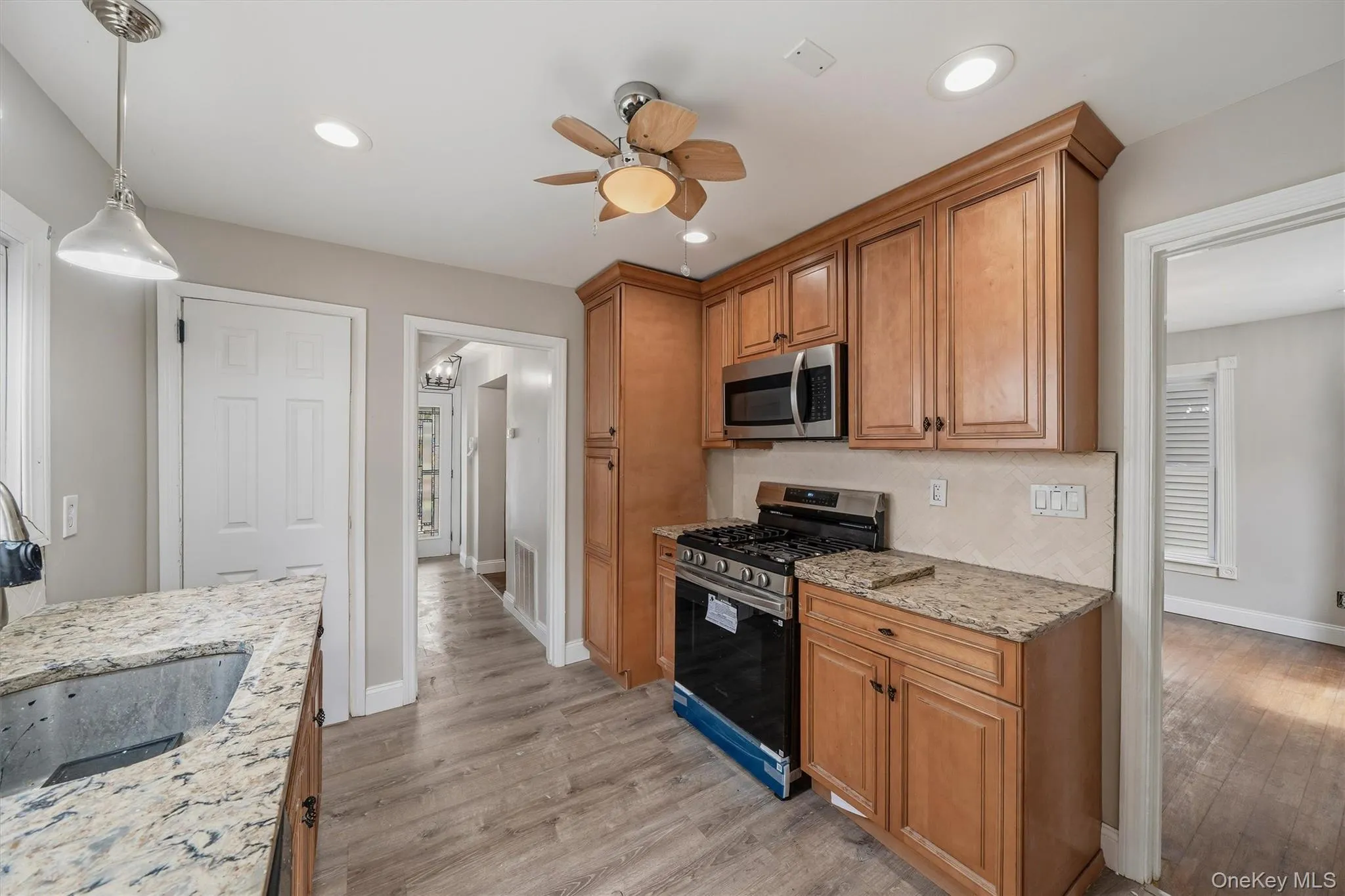 Walk through kitchen with luxury vinyl flooring. Walk through kitchen with luxury vinyl flooring.