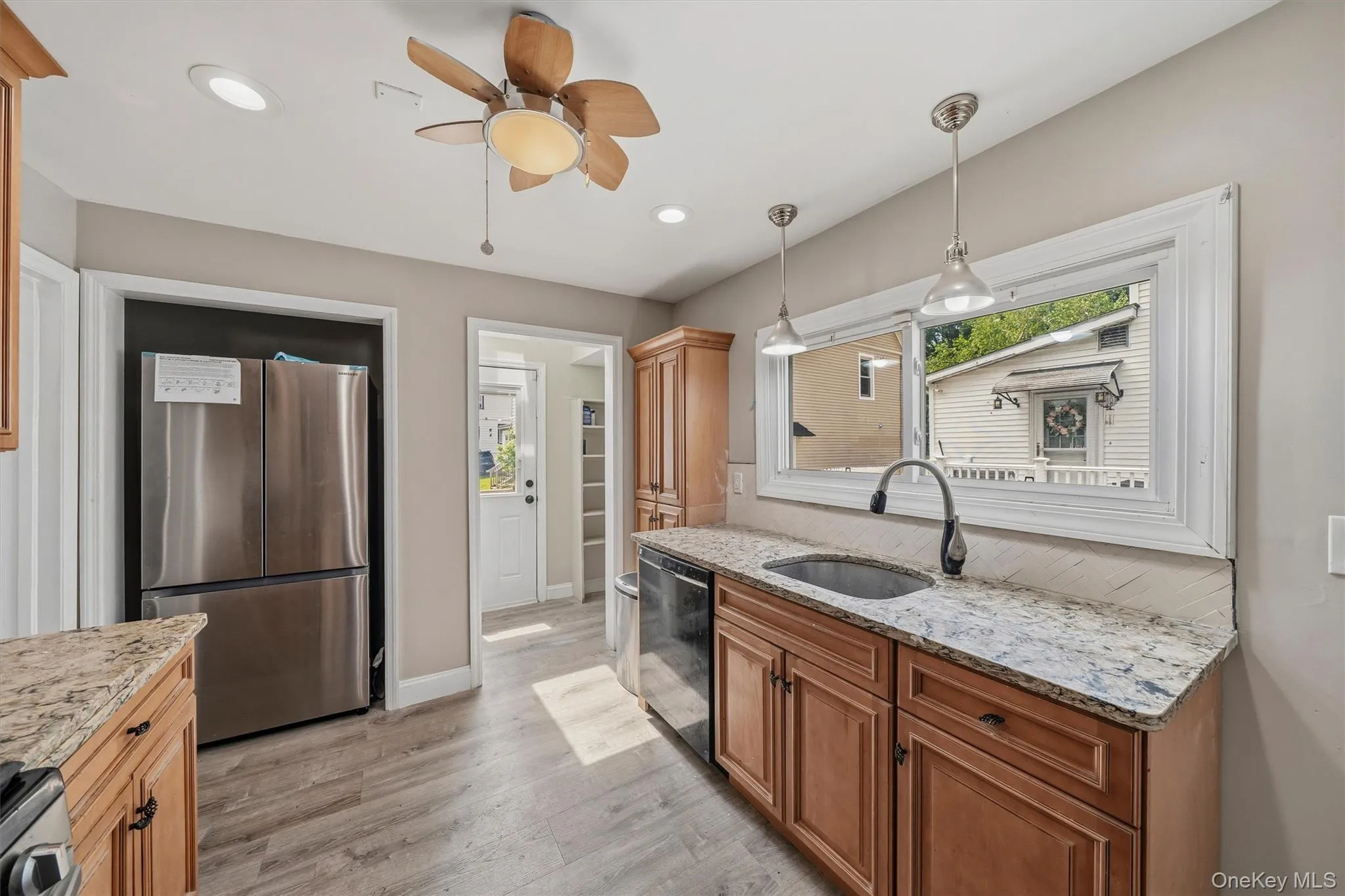 Updated Galley kitchen with granite countertops and luxury vinyl flooring. Updated Galley kitchen with granite countertops and luxury vinyl flooring.