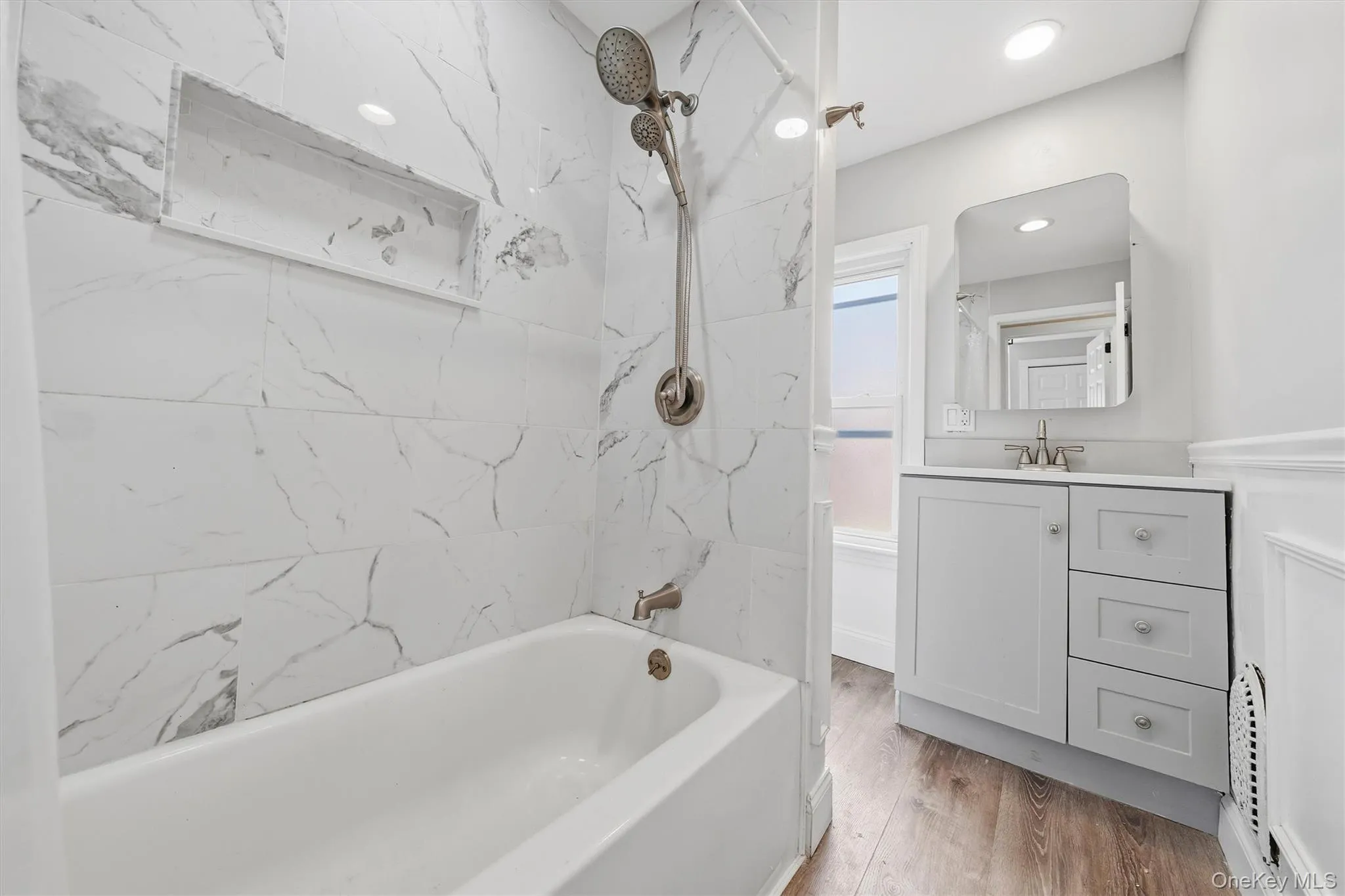 Full updated bathroom with a convenient niche insert. Full updated bathroom with a convenient niche insert.