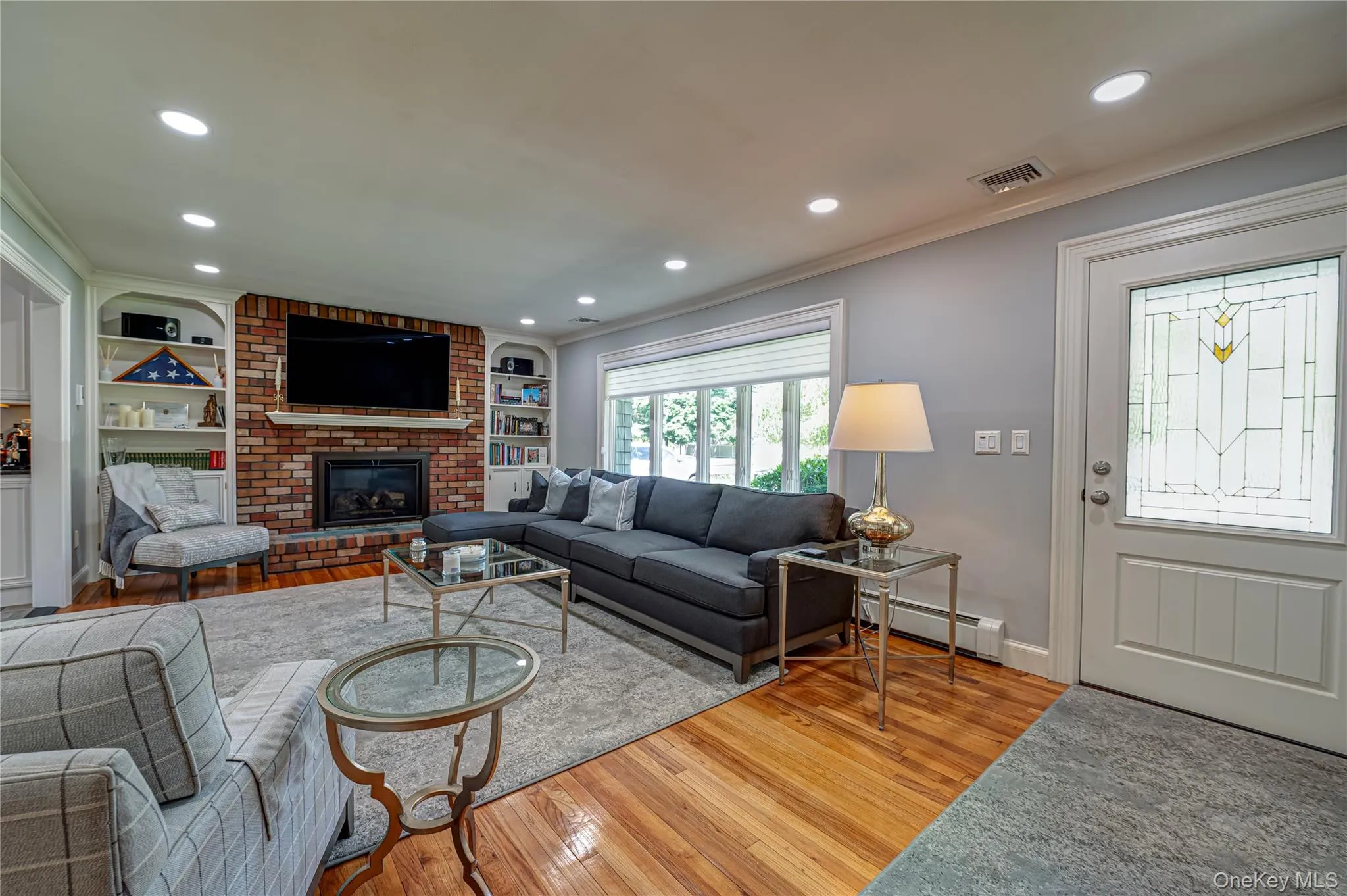 Formal Living Room With Custom Built in Bookcases and Cabinets and Huge Front Bow Window Formal Living Room With Custom Built in Bookcases and Cabinets and Huge Front Bow Window