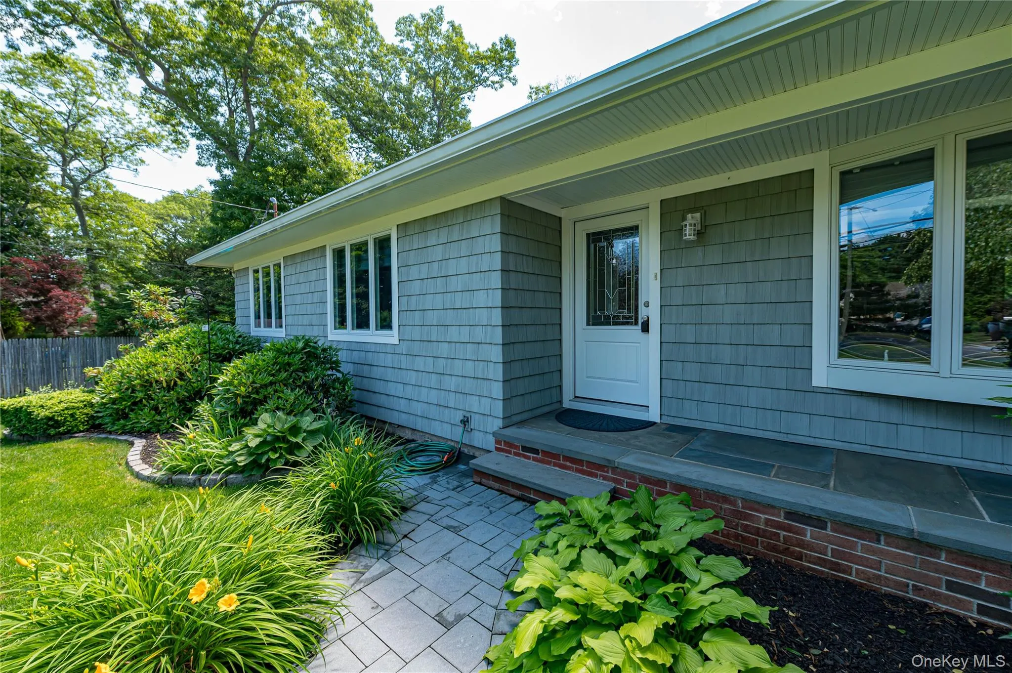 Bluestone Covered Portico With all Gardens Surrounded by Cobblestone Bluestone Covered Portico With all Gardens Surrounded by Cobblestone