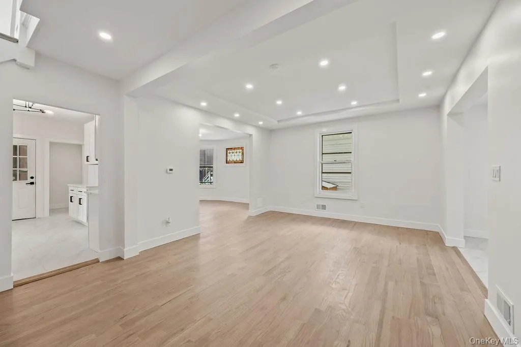 Empty room featuring light wood-type flooring and recessed lighting Empty room featuring light wood-type flooring and recessed lighting