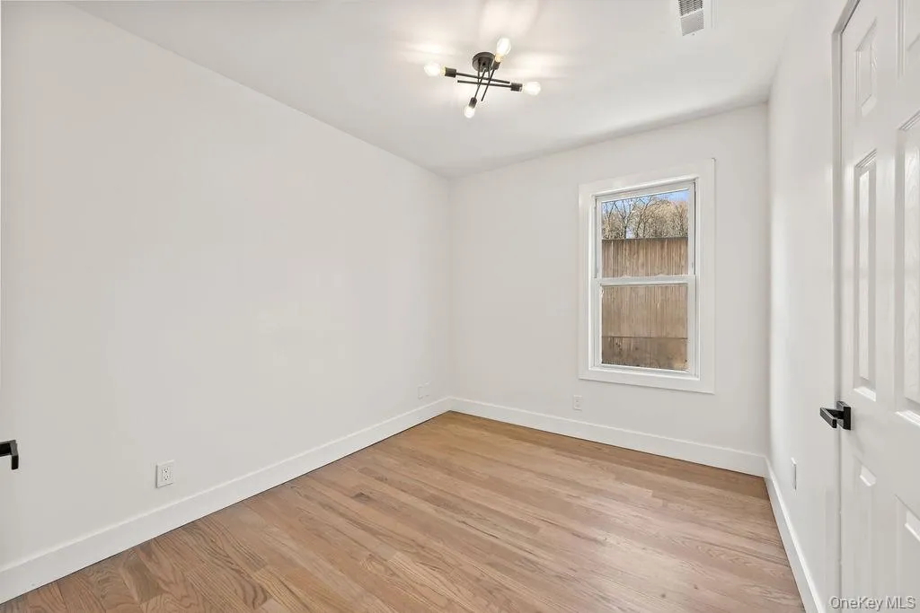 Unfurnished bedroom featuring light wood-type flooring Unfurnished bedroom featuring light wood-type flooring