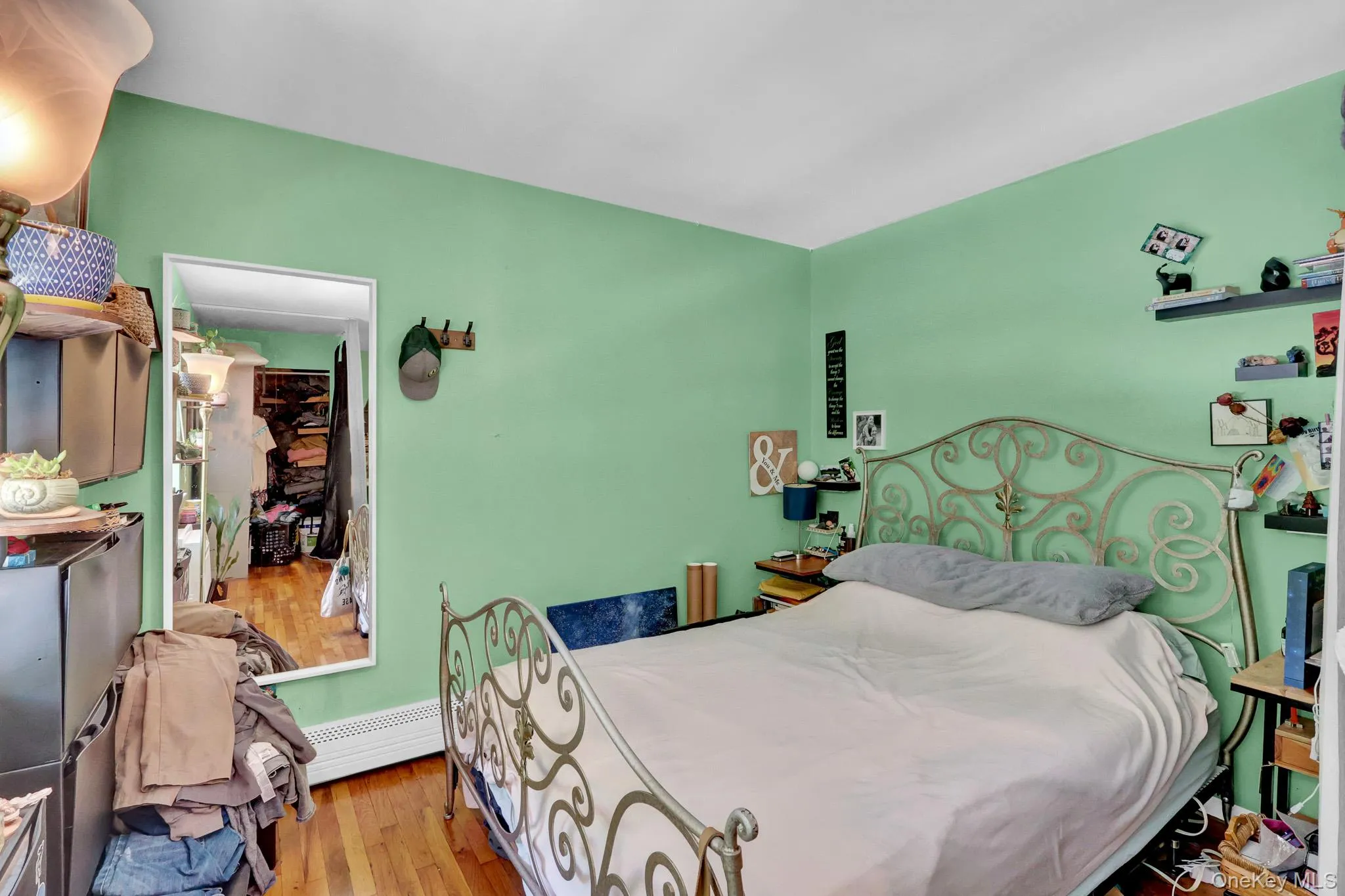 Hardwood-style flooring throughout this room with light green painted walls Hardwood-style flooring throughout this room with light green painted walls