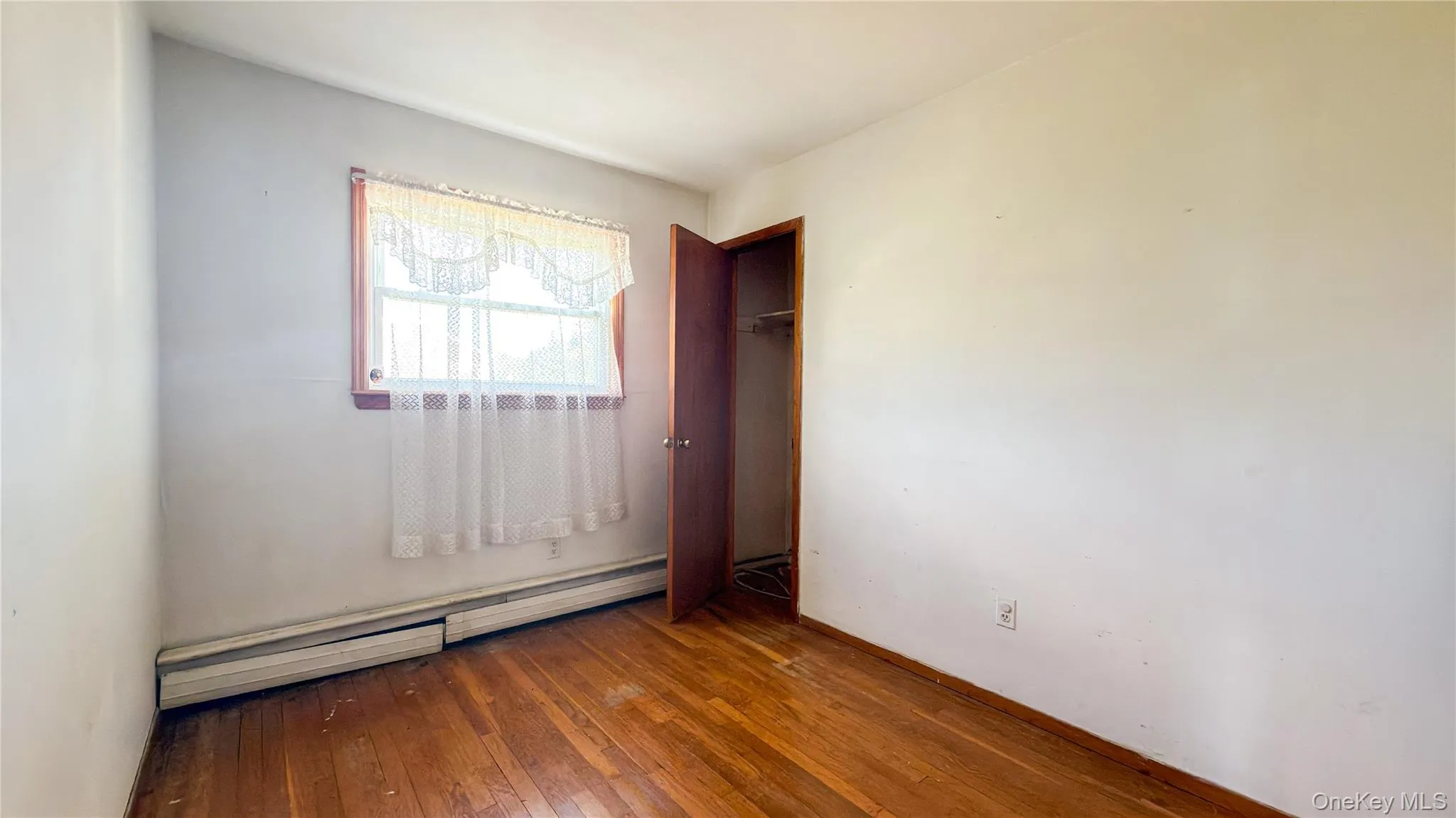 Bedroom with wood floors Bedroom with wood floors