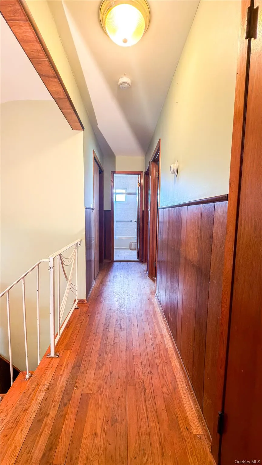 Second floor hallway with wood floors Second floor hallway with wood floors
