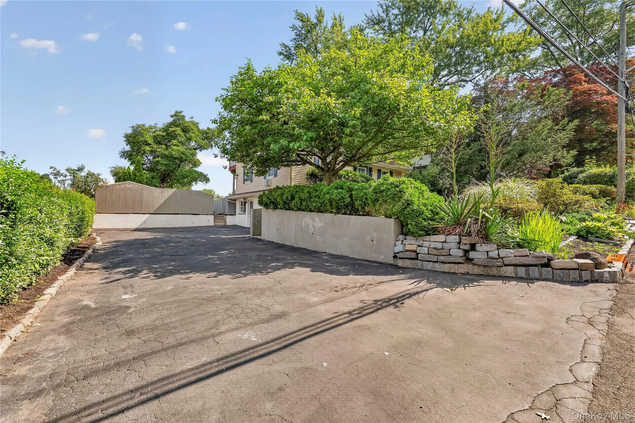 The over-sized driveway can accommodate over 6 cars. The over-sized driveway can accommodate over 6 cars.