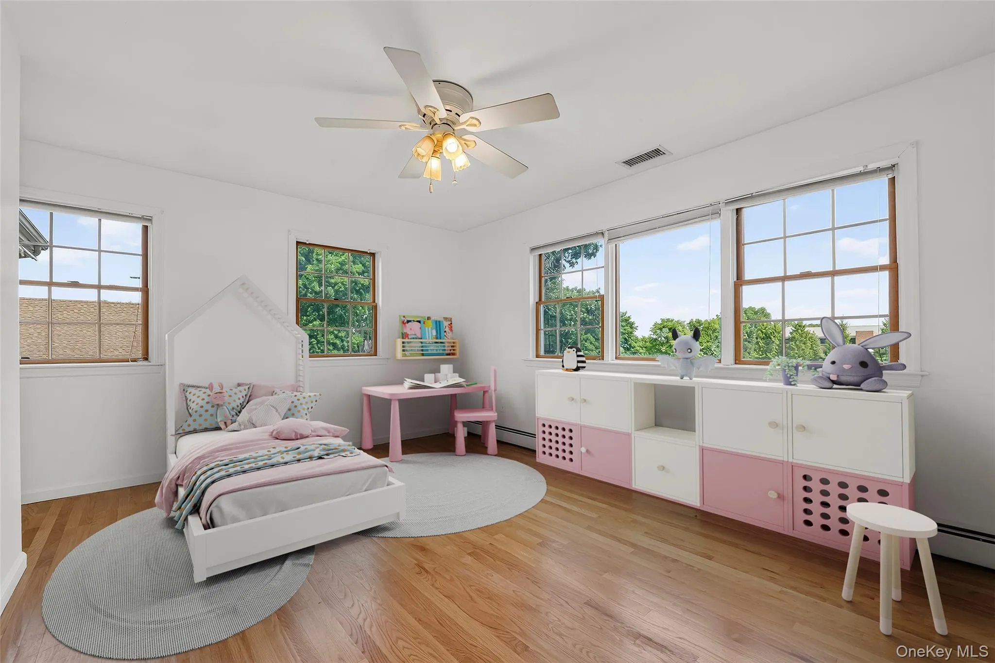 Virtually staged bedroom on the second level with abundant windows and pastoral views. Virtually staged bedroom on the second level with abundant windows and pastoral views.