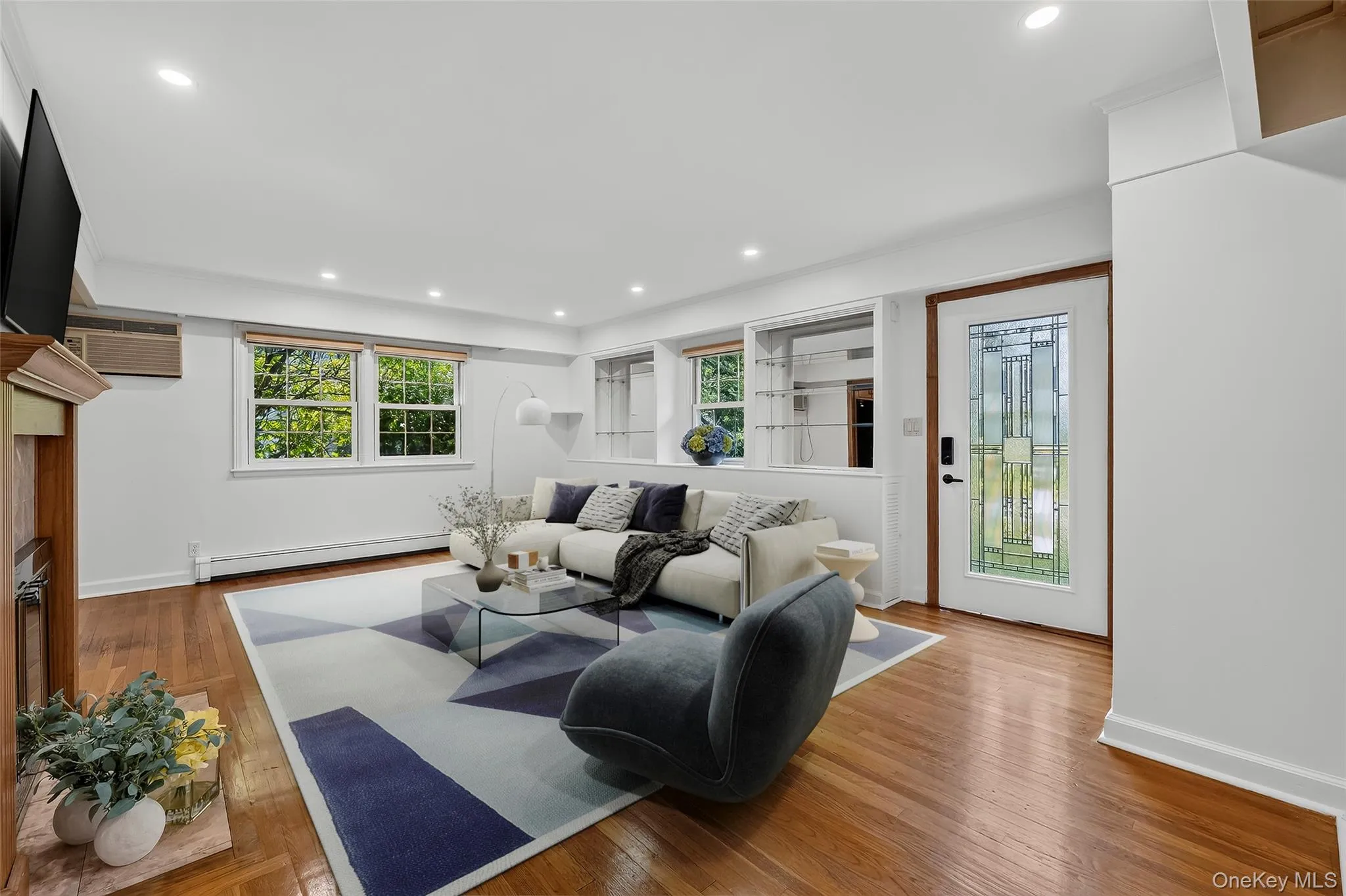 Spacious and gracious living room with wood firelace. Virtually staged. Spacious and gracious living room with wood firelace. Virtually staged.