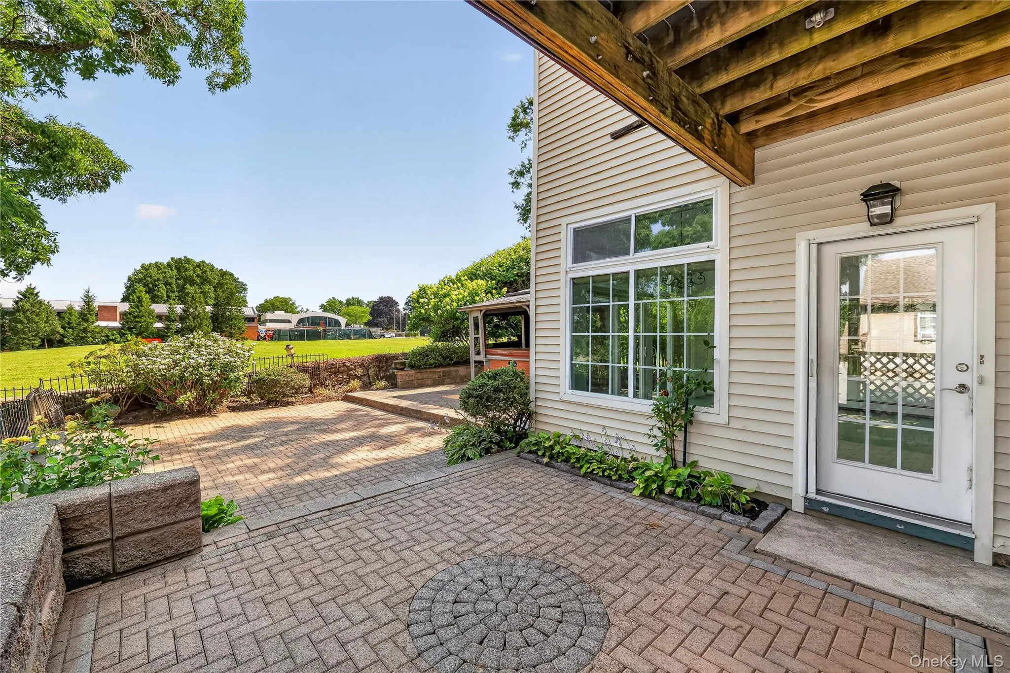 The back yard offers expansive views of the parkike property of the German School. The back yard offers expansive views of the parkike property of the German School.