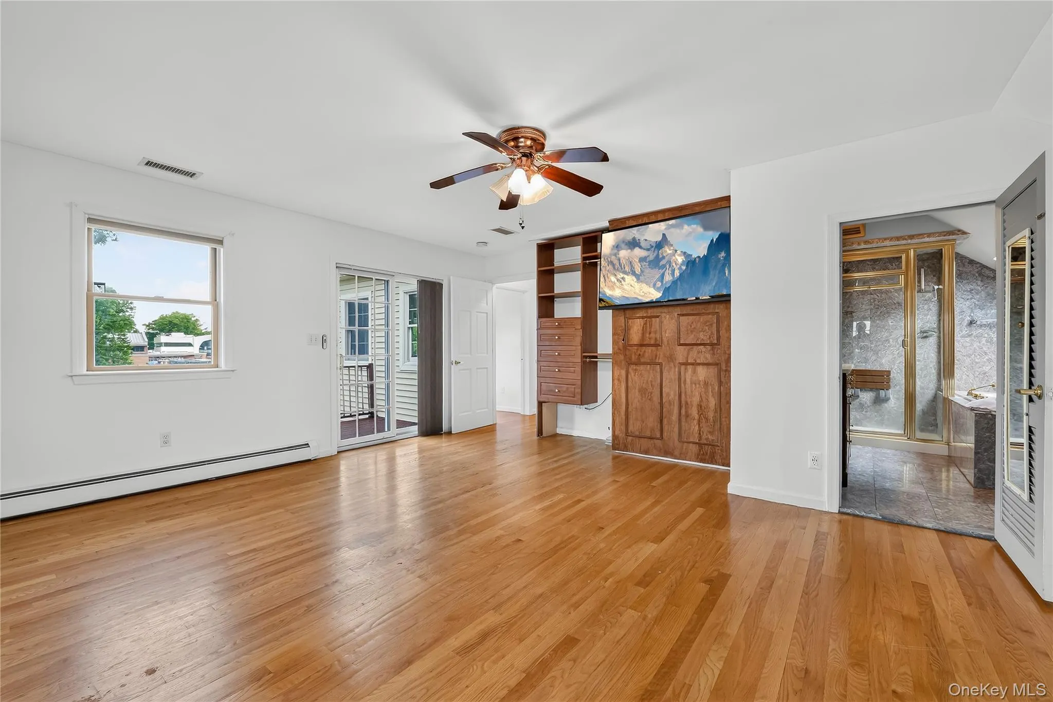 The primary bedroom offers excellent closet space, spa bath and private balcony. The primary bedroom offers excellent closet space, spa bath and private balcony.
