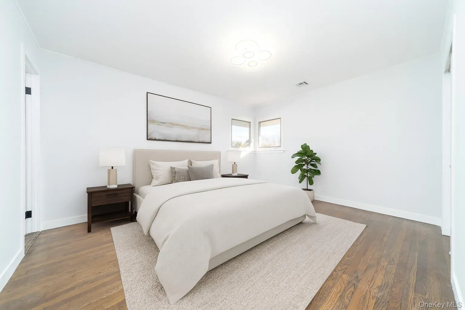 Bedroom featuring dark wood finished floors Bedroom featuring dark wood finished floors