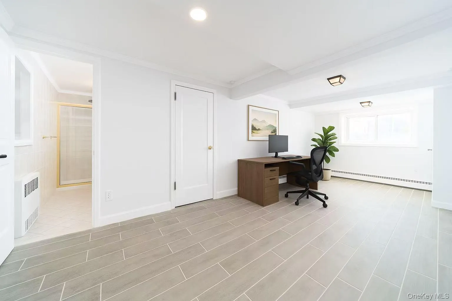 Office area with crown molding, a baseboard radiator, radiator heating unit, recessed lighting, and wood finish floors Office area with crown molding, a baseboard radiator, radiator heating unit, recessed lighting, and wood finish floors