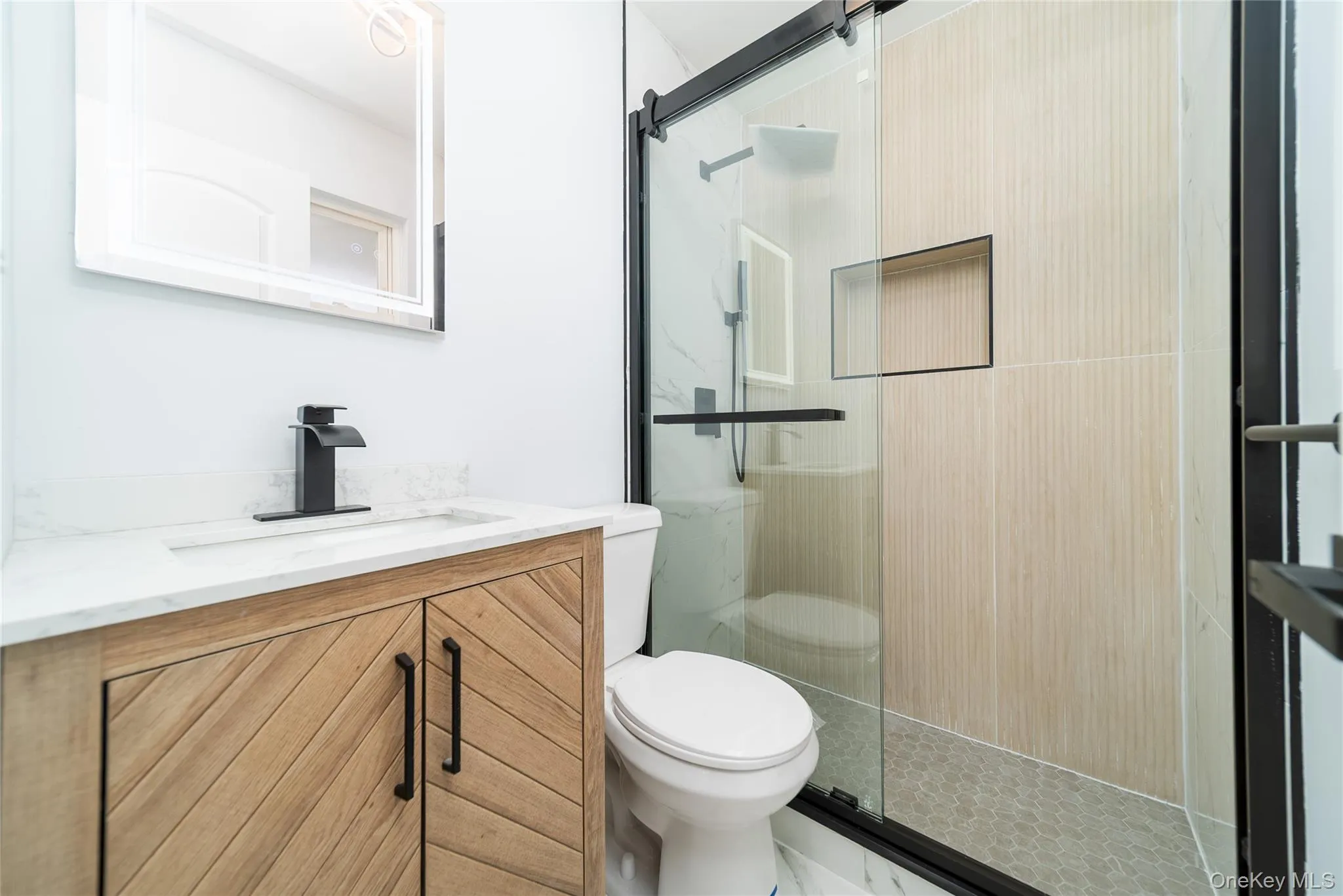 Full bathroom with vanity and a stall shower Full bathroom with vanity and a stall shower
